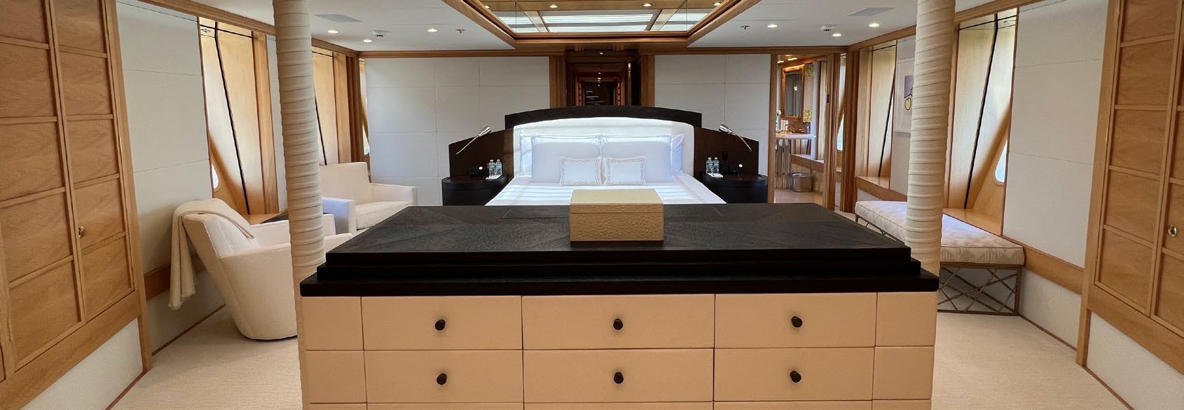 a room with a large table and a large window aboard SPORT Yacht for Charter