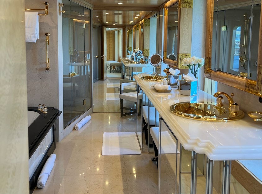 a bathroom with a sink and a mirror aboard SPORT Yacht for Charter