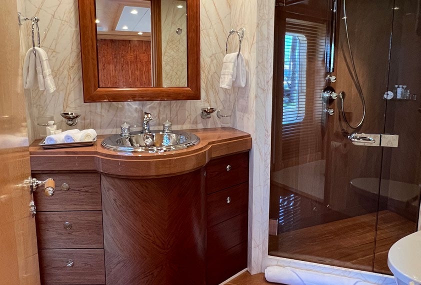 a bathroom with a sink and a mirror aboard SPORT Yacht for Charter