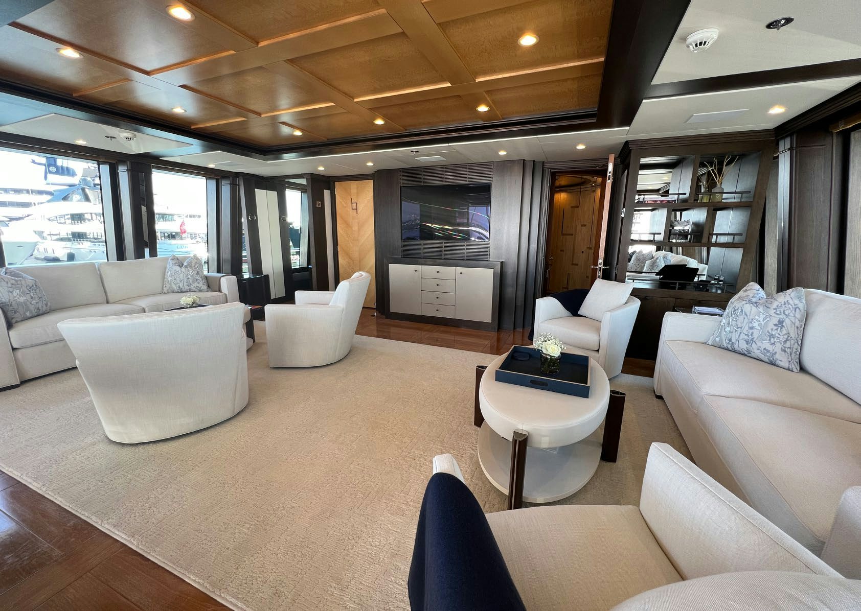 a living room with a large window aboard SPORT Yacht for Charter