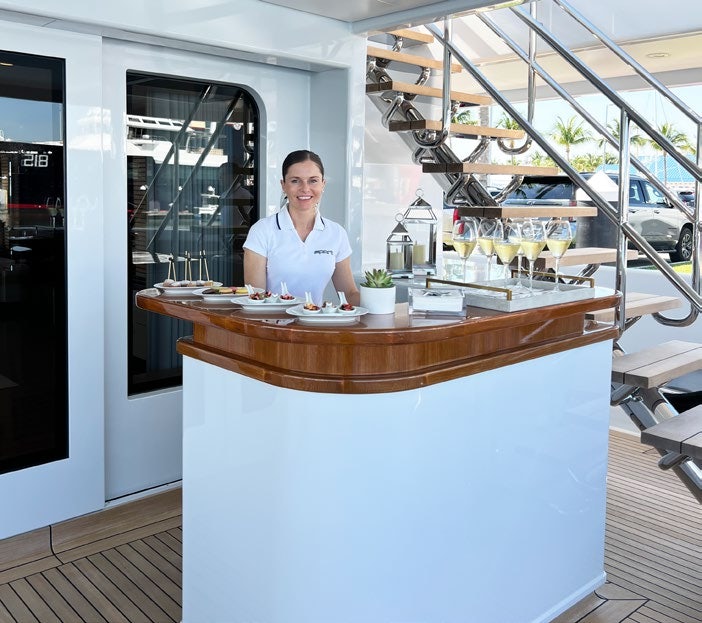 a man standing behind a counter aboard SPORT Yacht for Charter