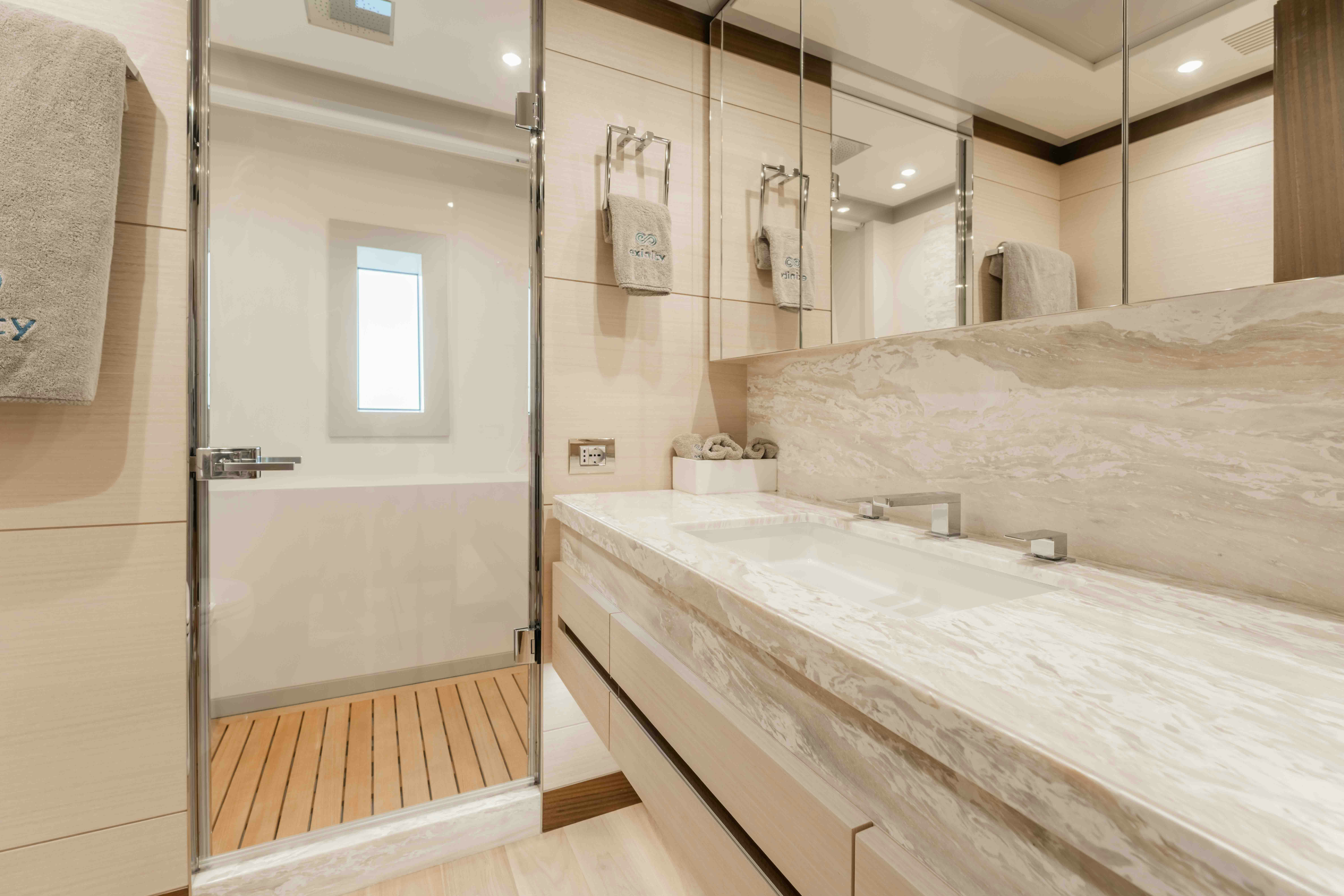 a bathroom with a large bathtub aboard EXINITY Yacht for Sale