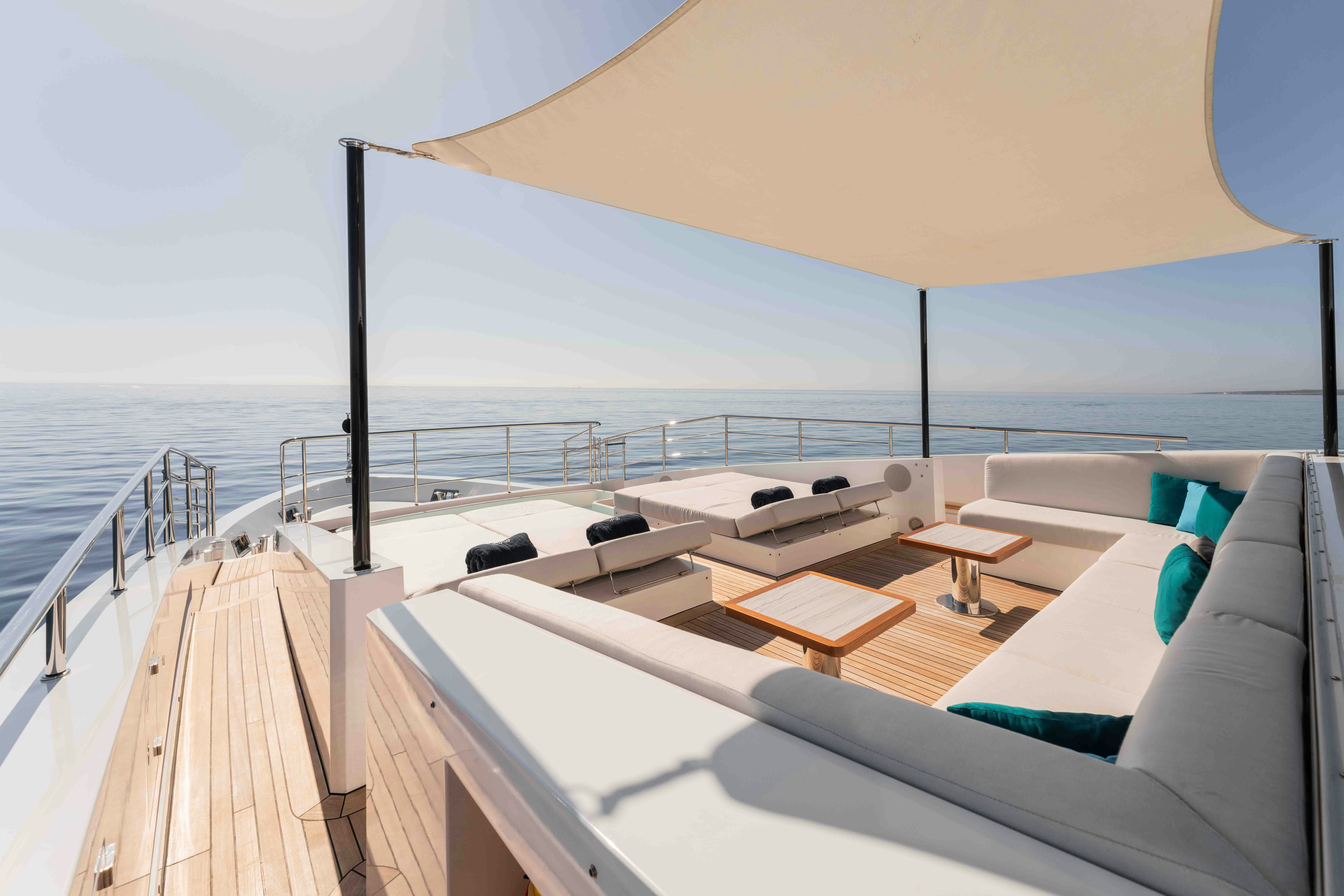 a large room with a balcony aboard EXINITY Yacht for Sale