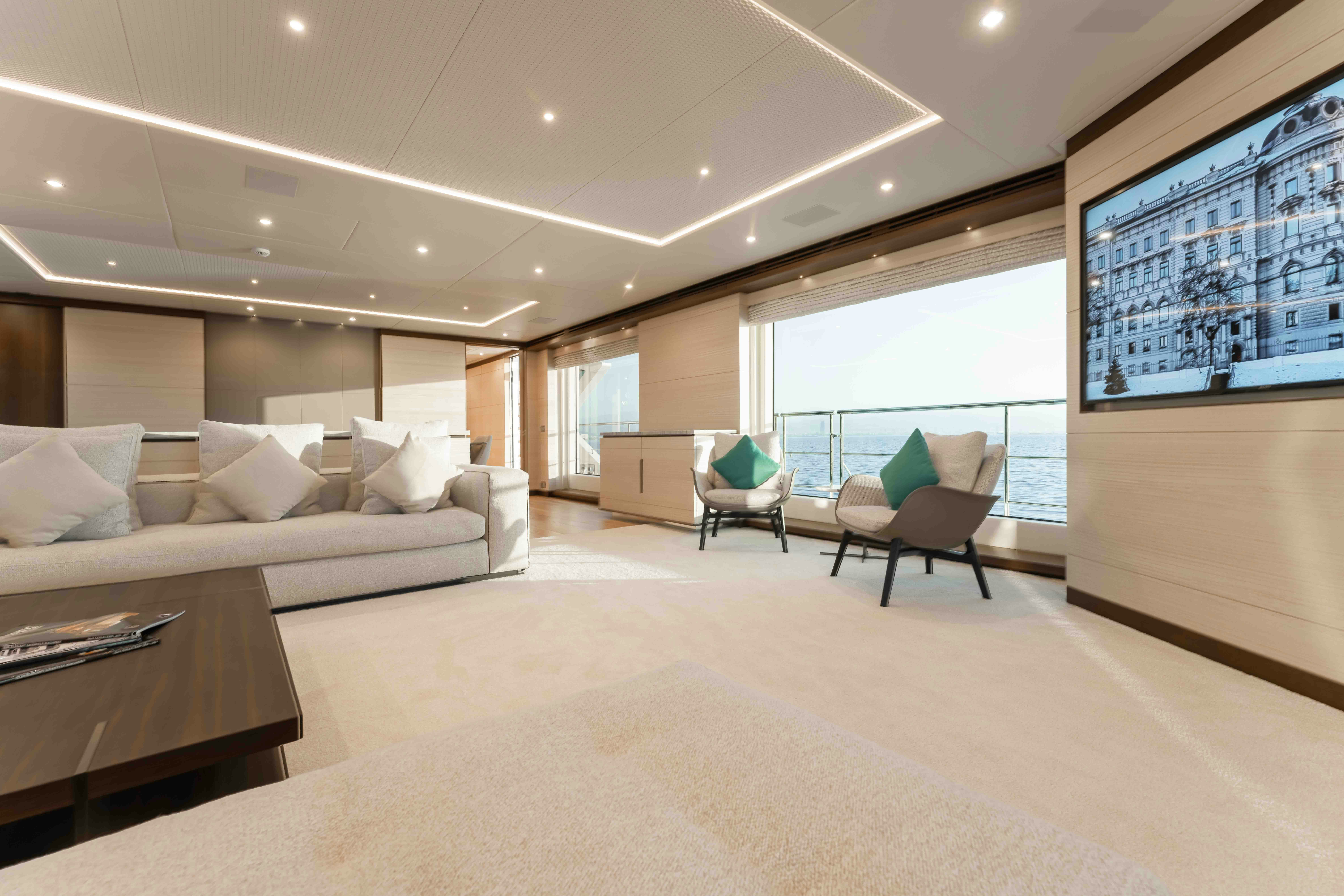 a large modern living room aboard EXINITY Yacht for Sale