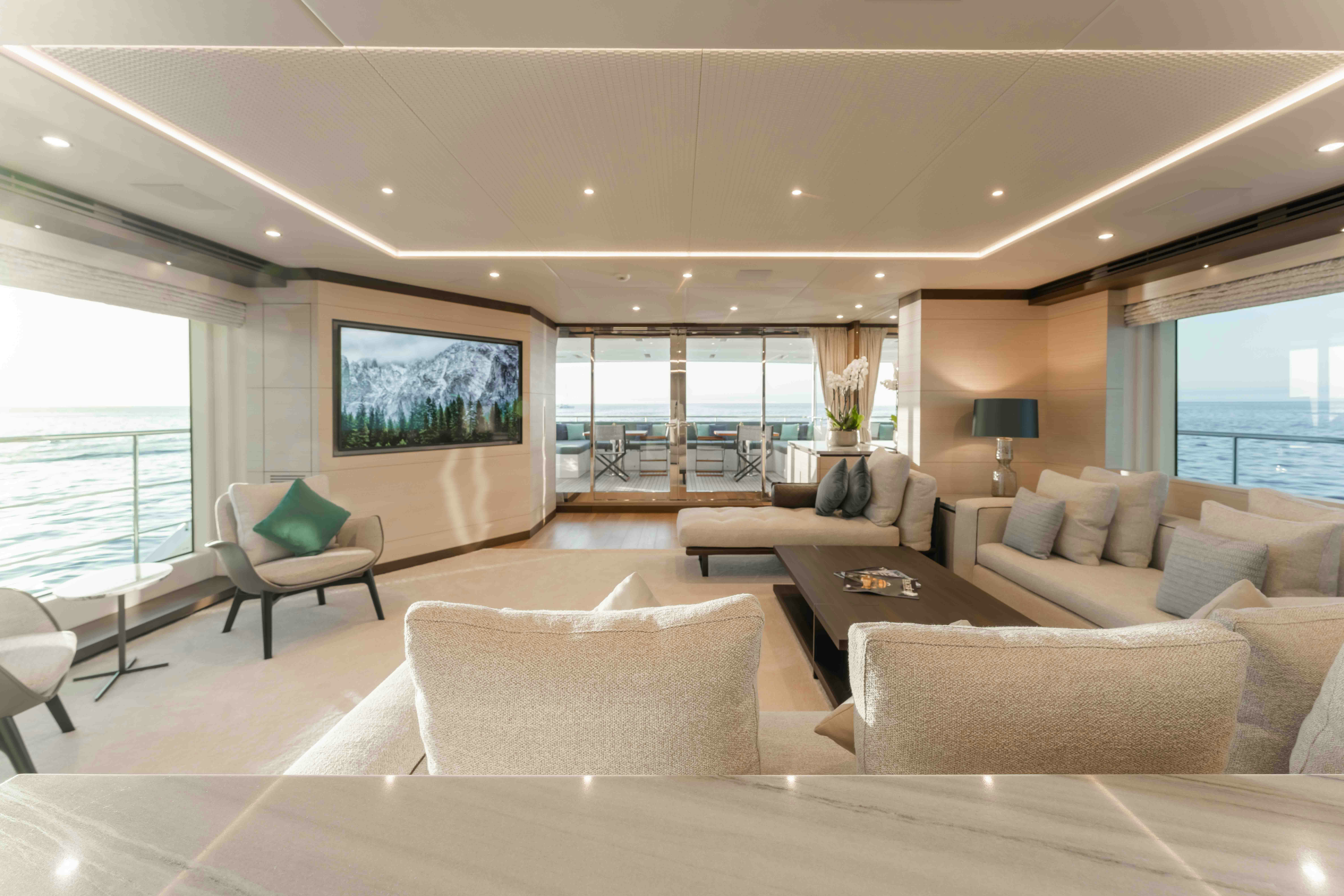 a living room with a large window aboard EXINITY Yacht for Sale