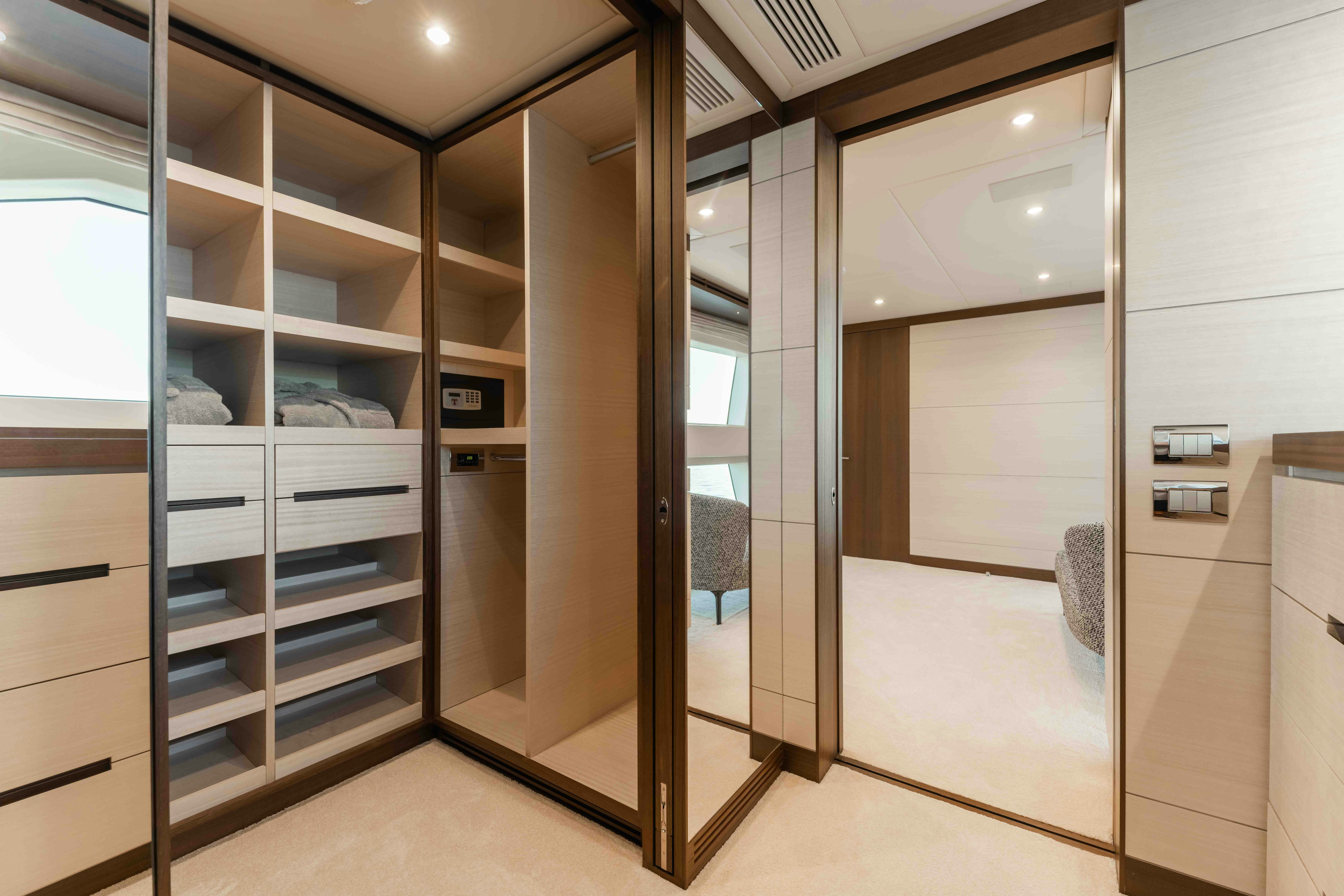 a room with a closet and shelves aboard EXINITY Yacht for Sale
