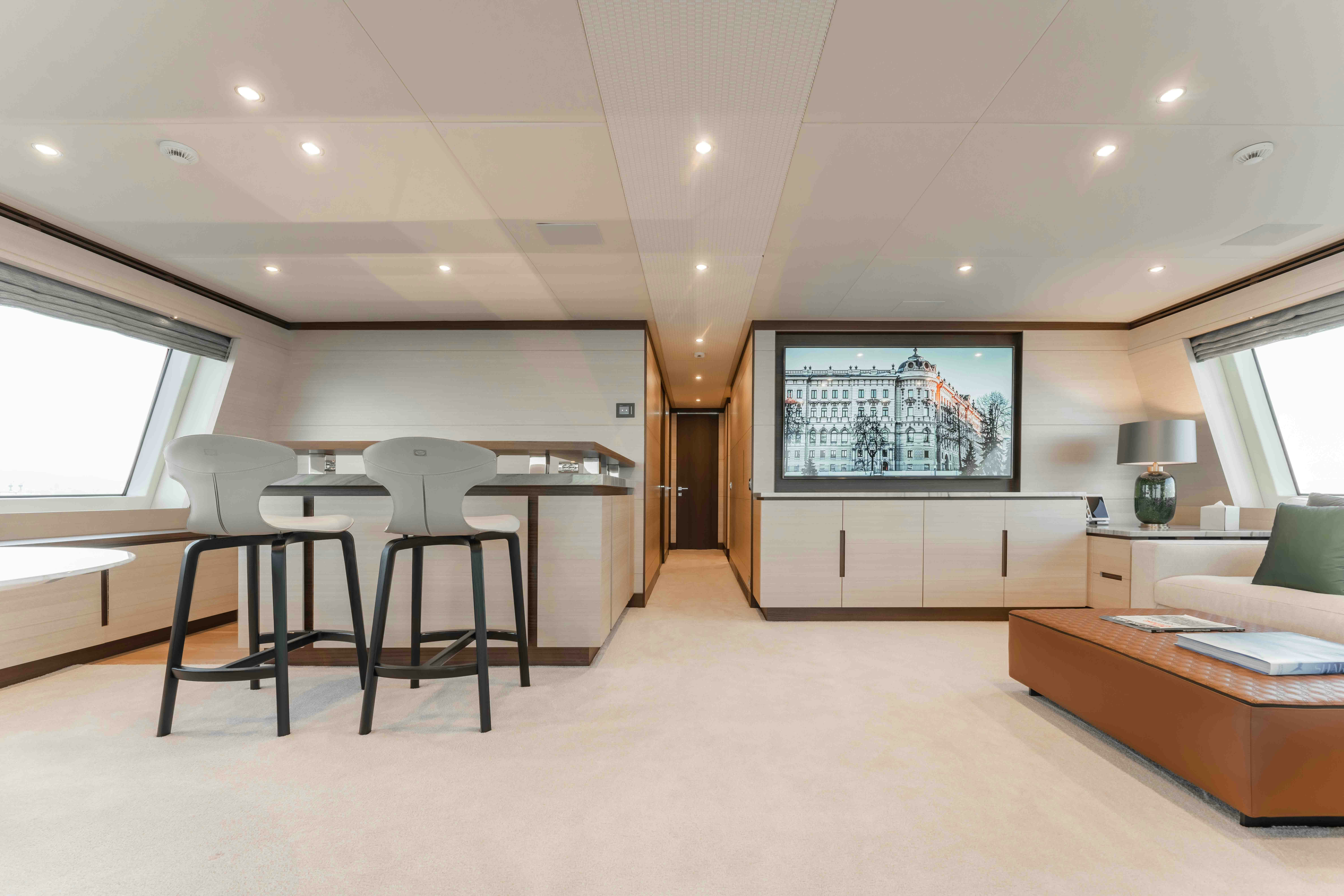 a room with a table and chairs aboard EXINITY Yacht for Sale