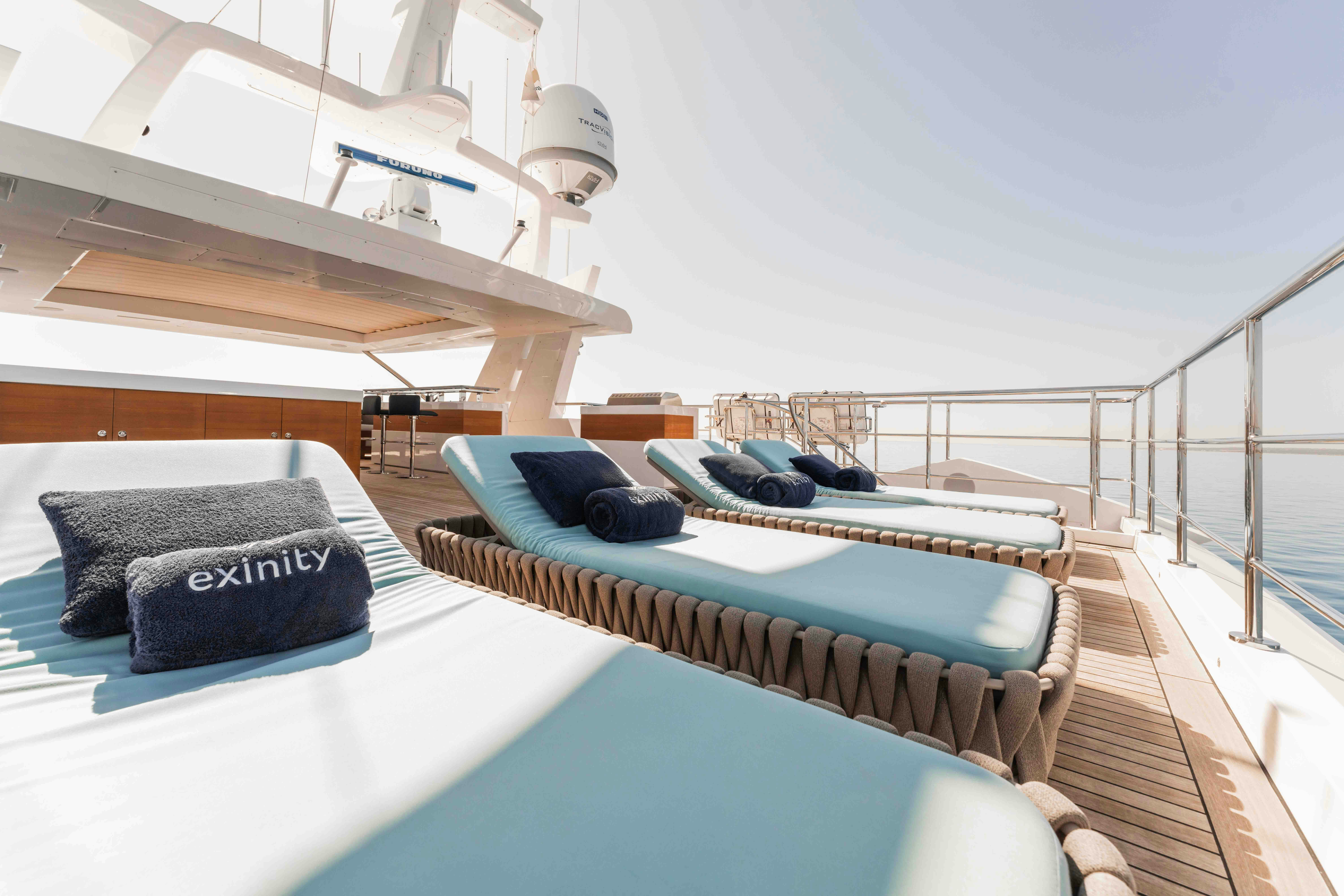 a large balcony with a pool aboard EXINITY Yacht for Sale