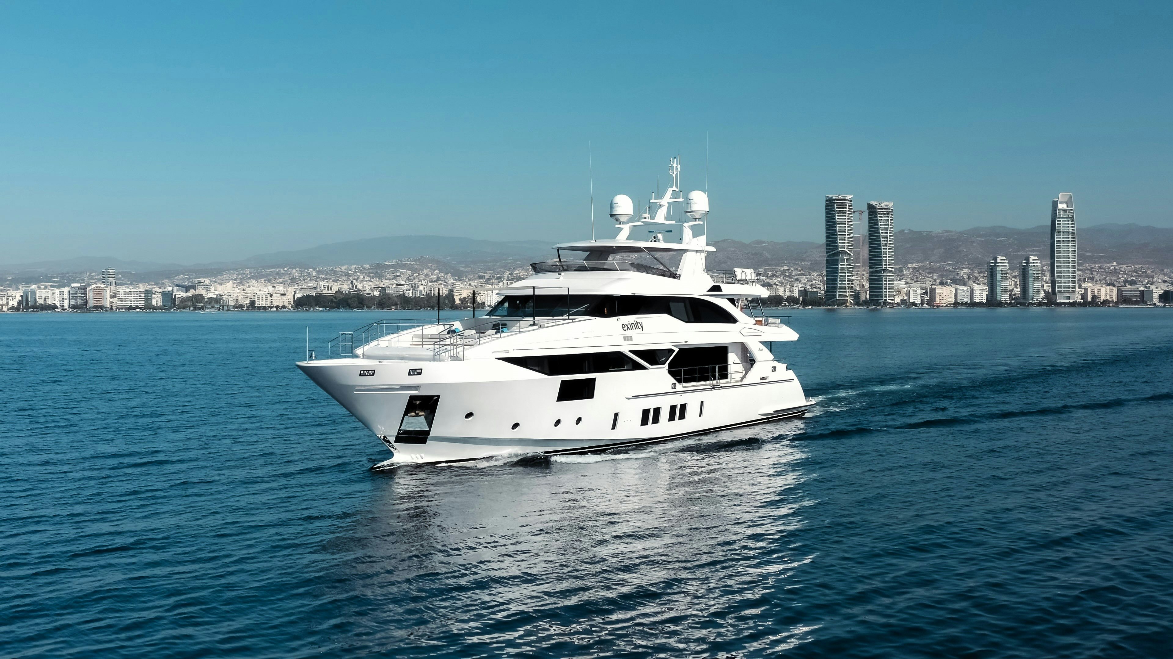 a white yacht in the water aboard EXINITY Yacht for Sale