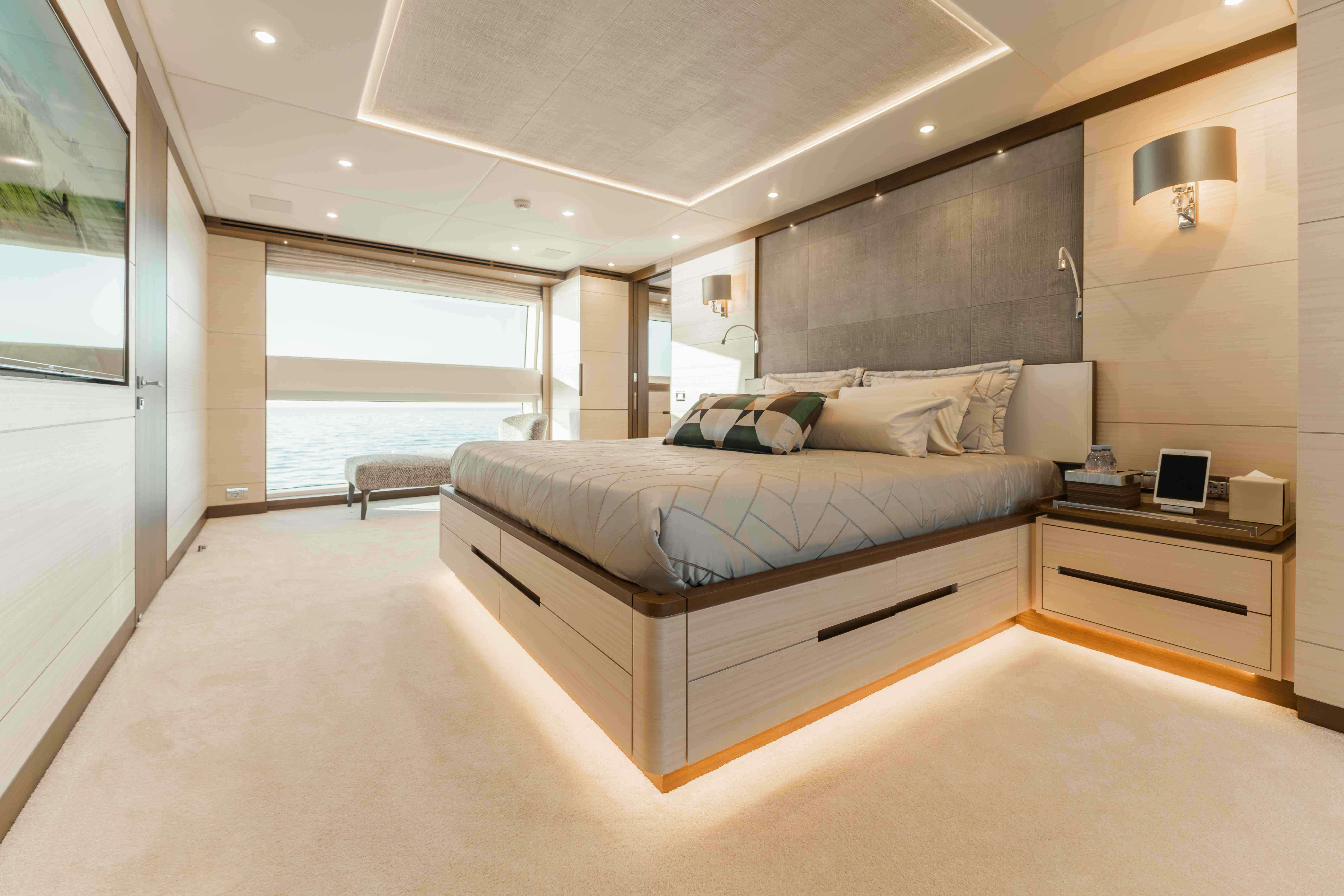 a large bed in a room aboard EXINITY Yacht for Sale
