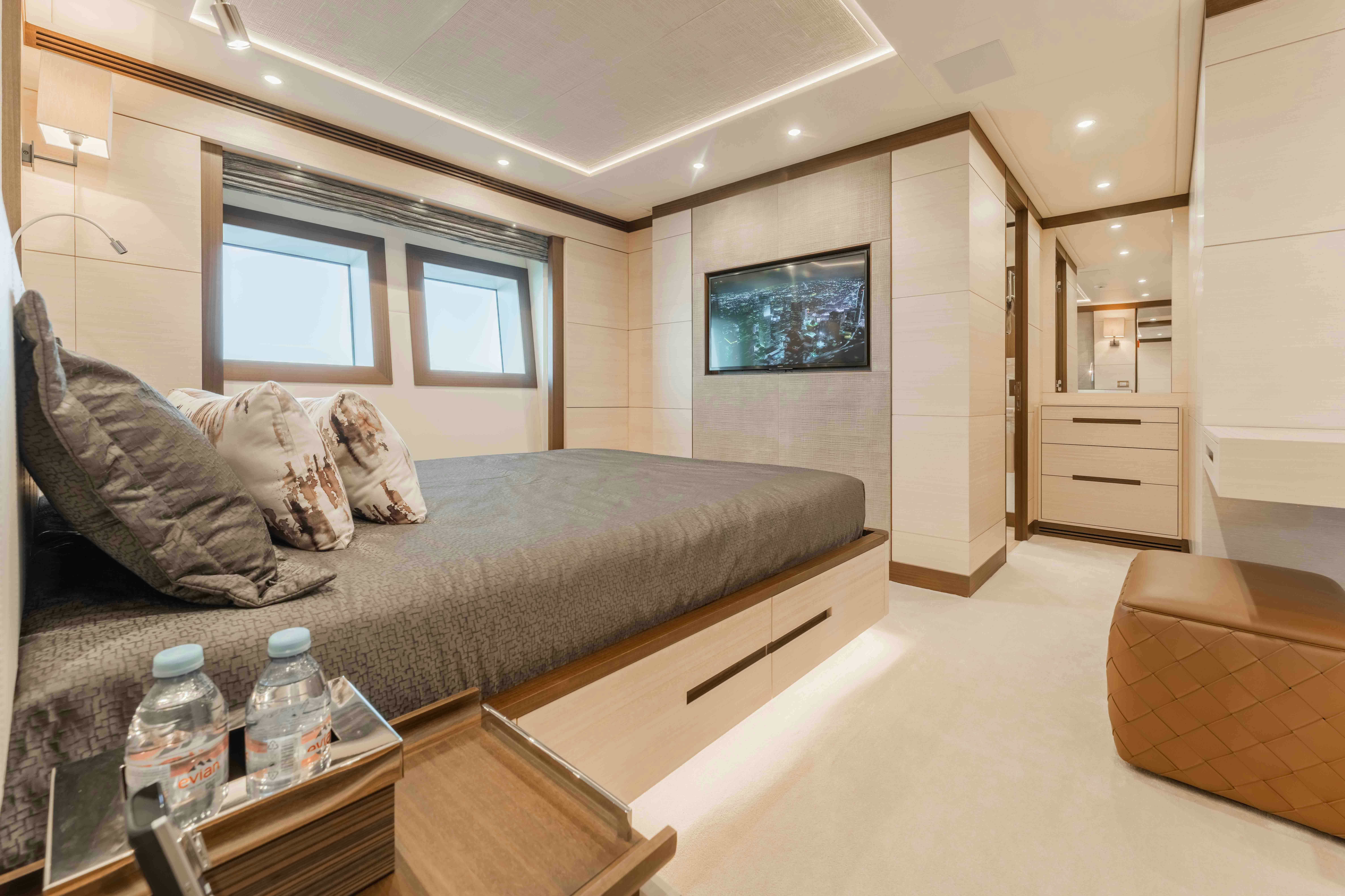 a living room with a couch and a coffee table aboard EXINITY Yacht for Sale