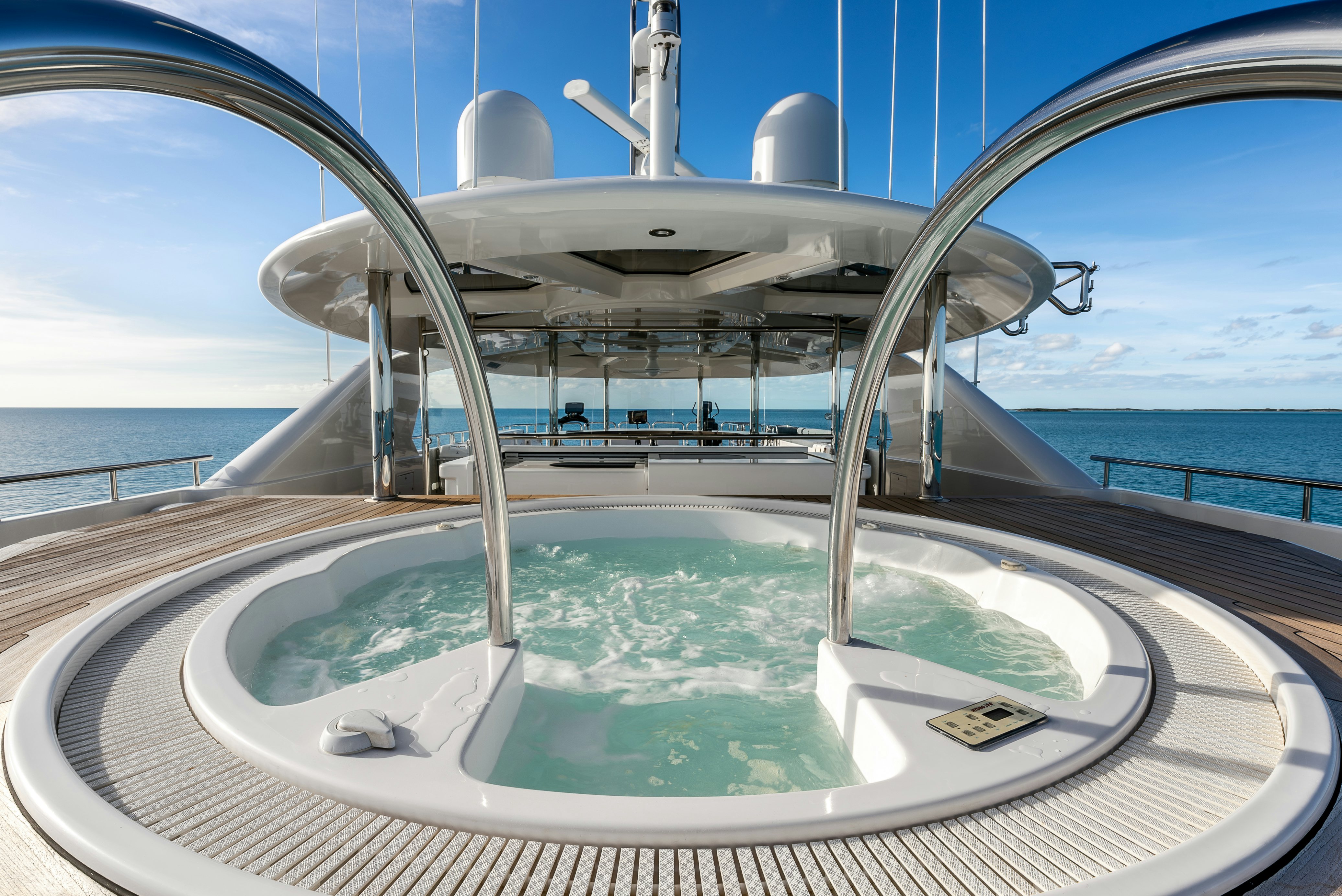 a large pool with a large round object in the middle aboard VALINOR Yacht for Sale