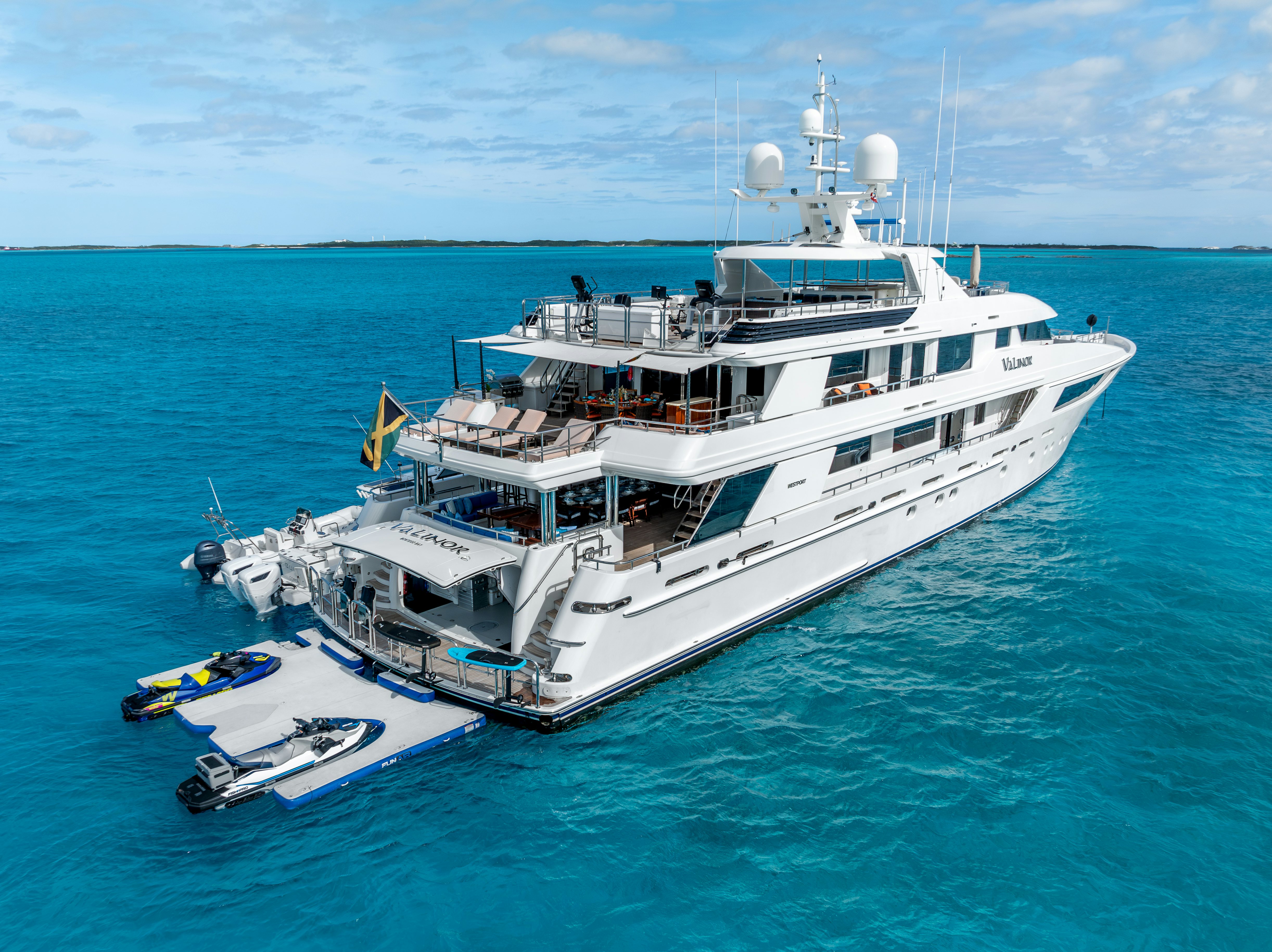 a large white ship with a boat on it aboard VALINOR Yacht for Sale