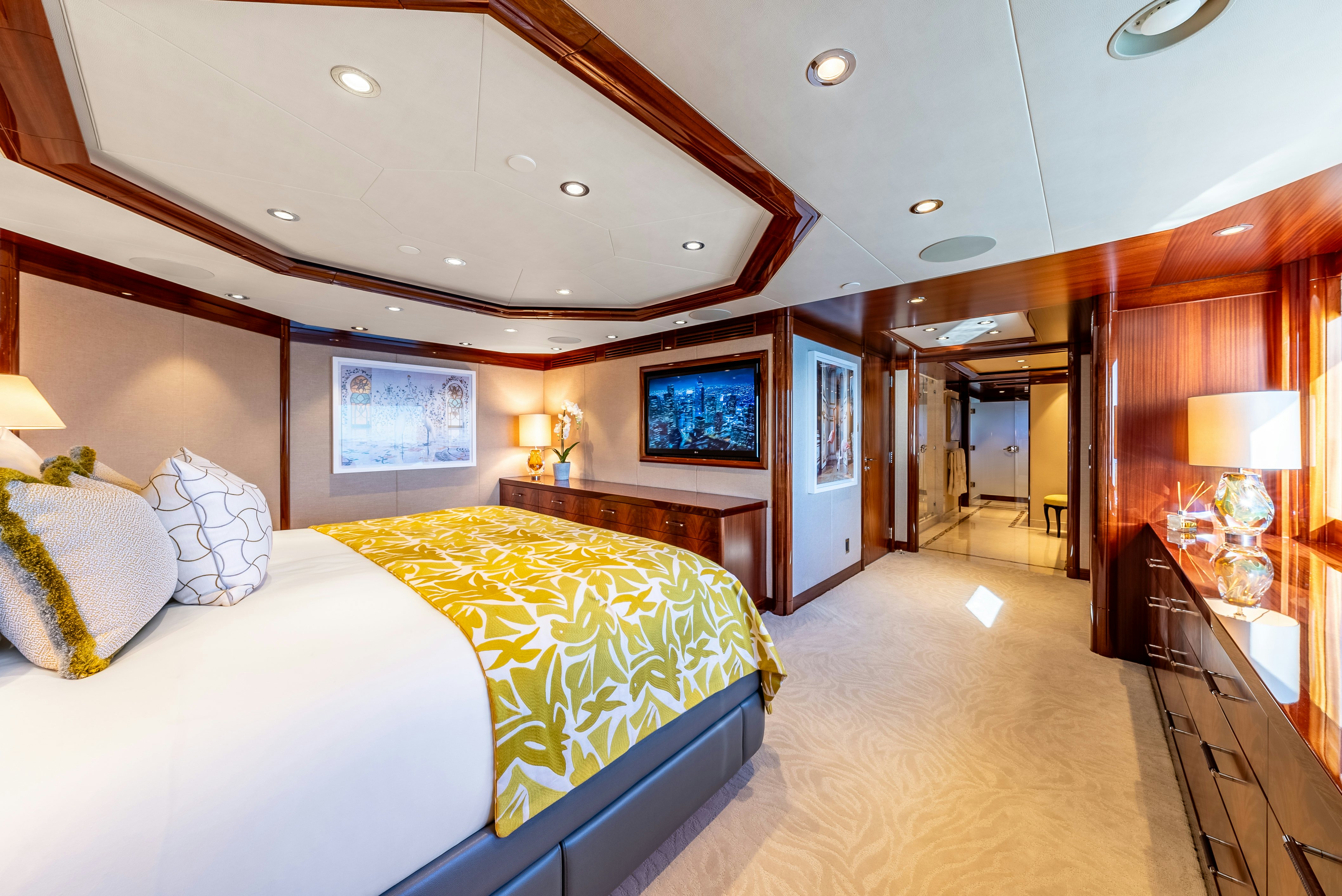 a room with a bed and a television aboard VALINOR Yacht for Sale
