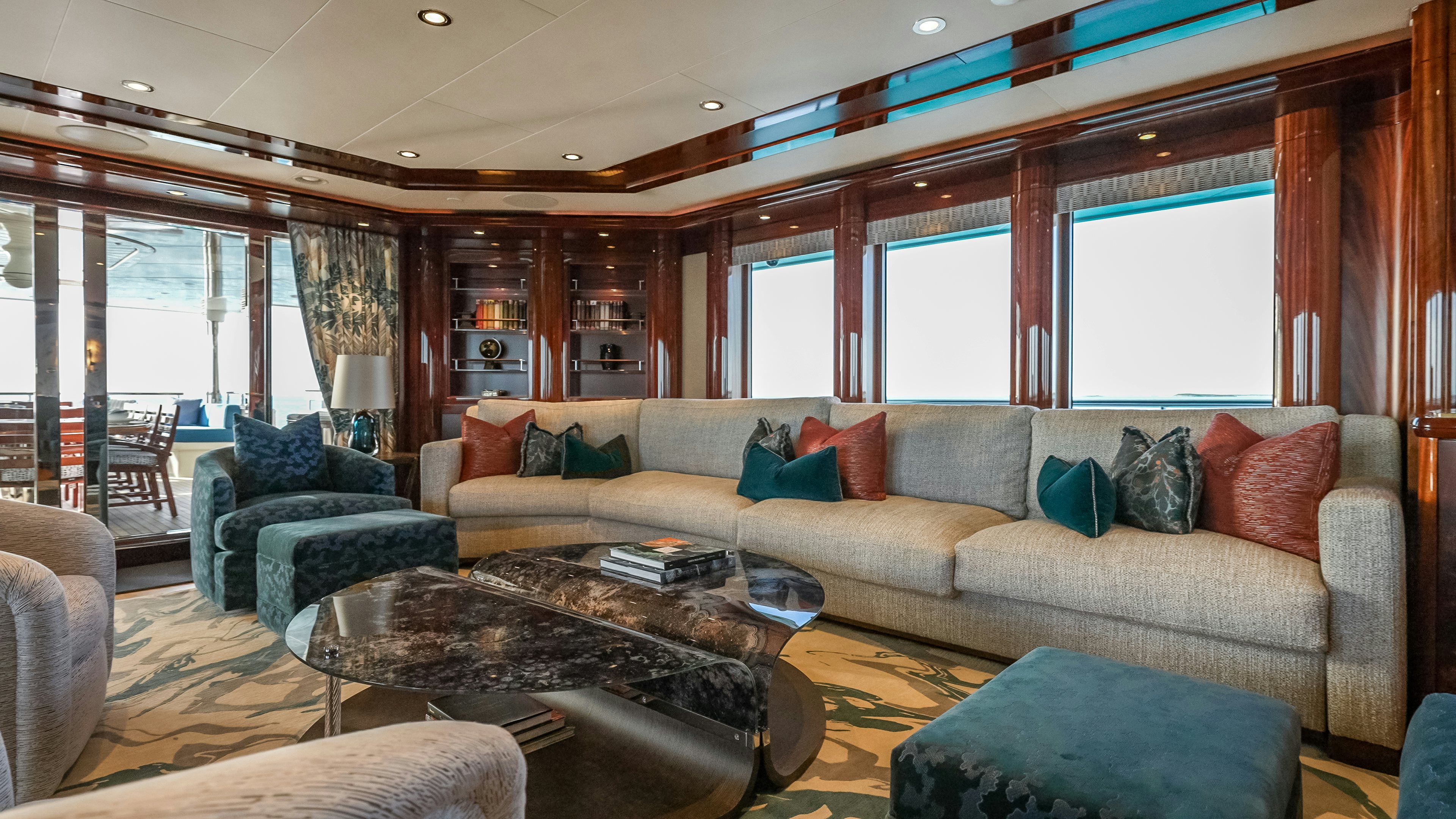 a living room with a couch and a coffee table aboard VALINOR Yacht for Sale