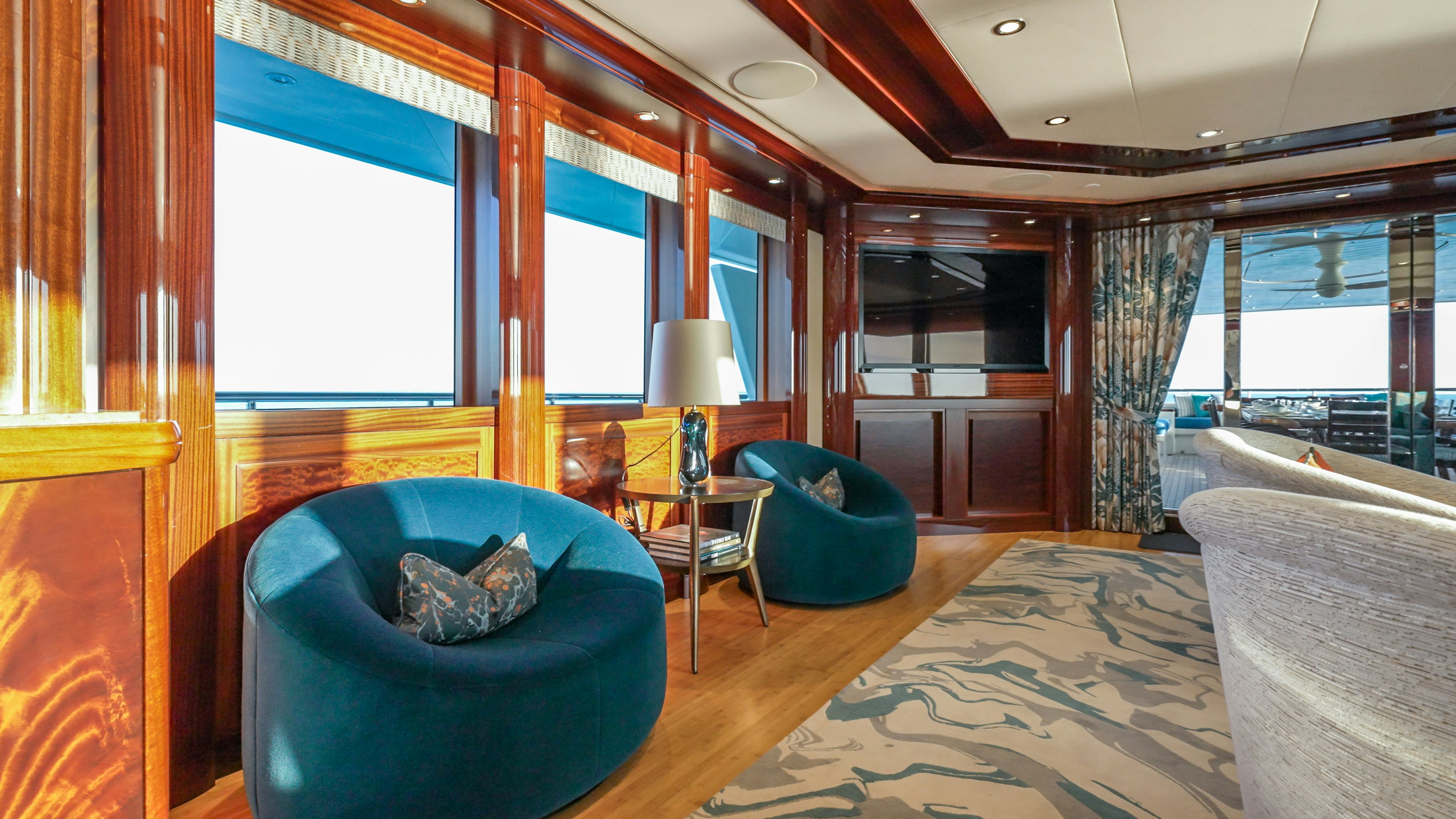 a living room with a large window aboard VALINOR Yacht for Sale