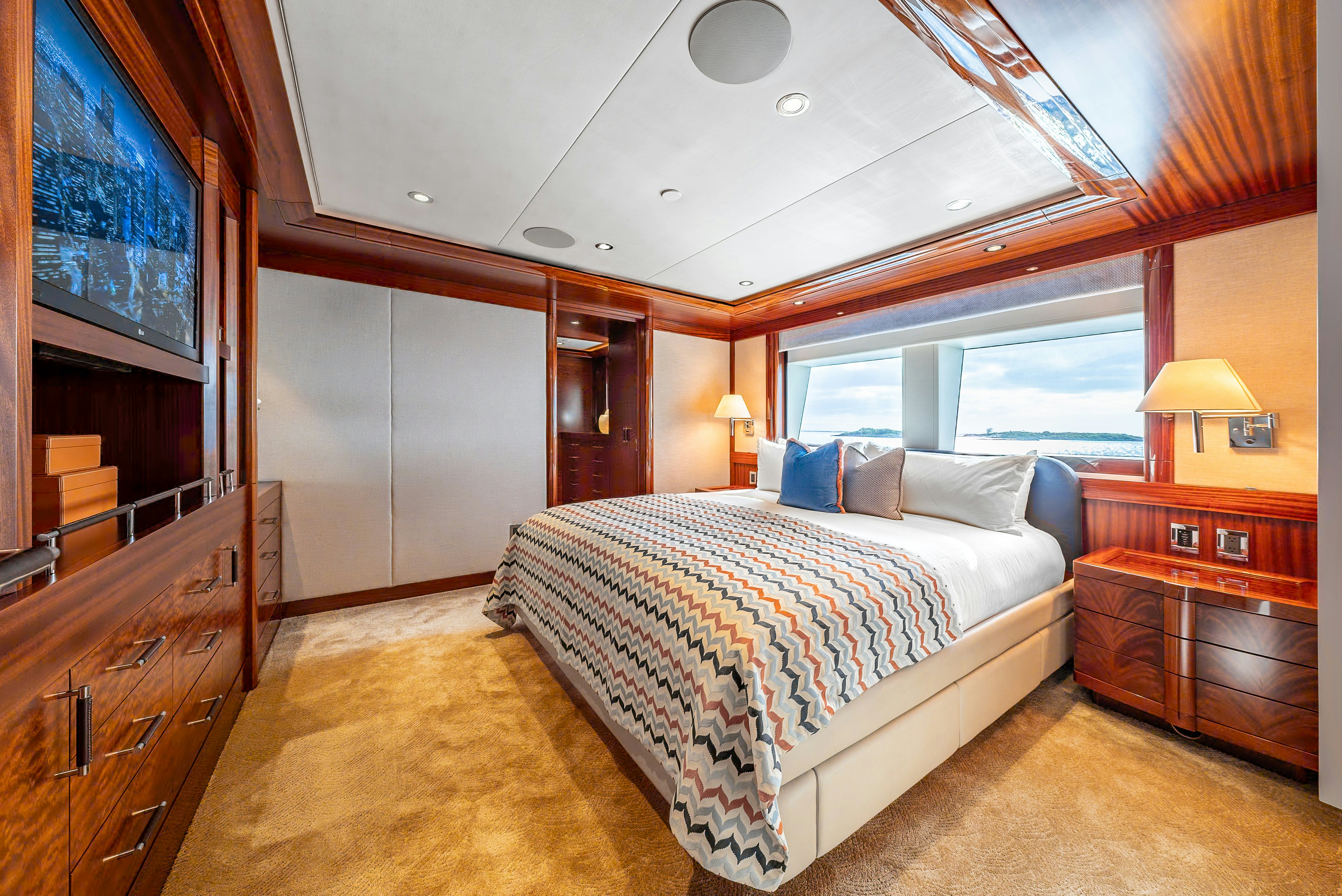 a large bedroom with a large bed aboard VALINOR Yacht for Sale