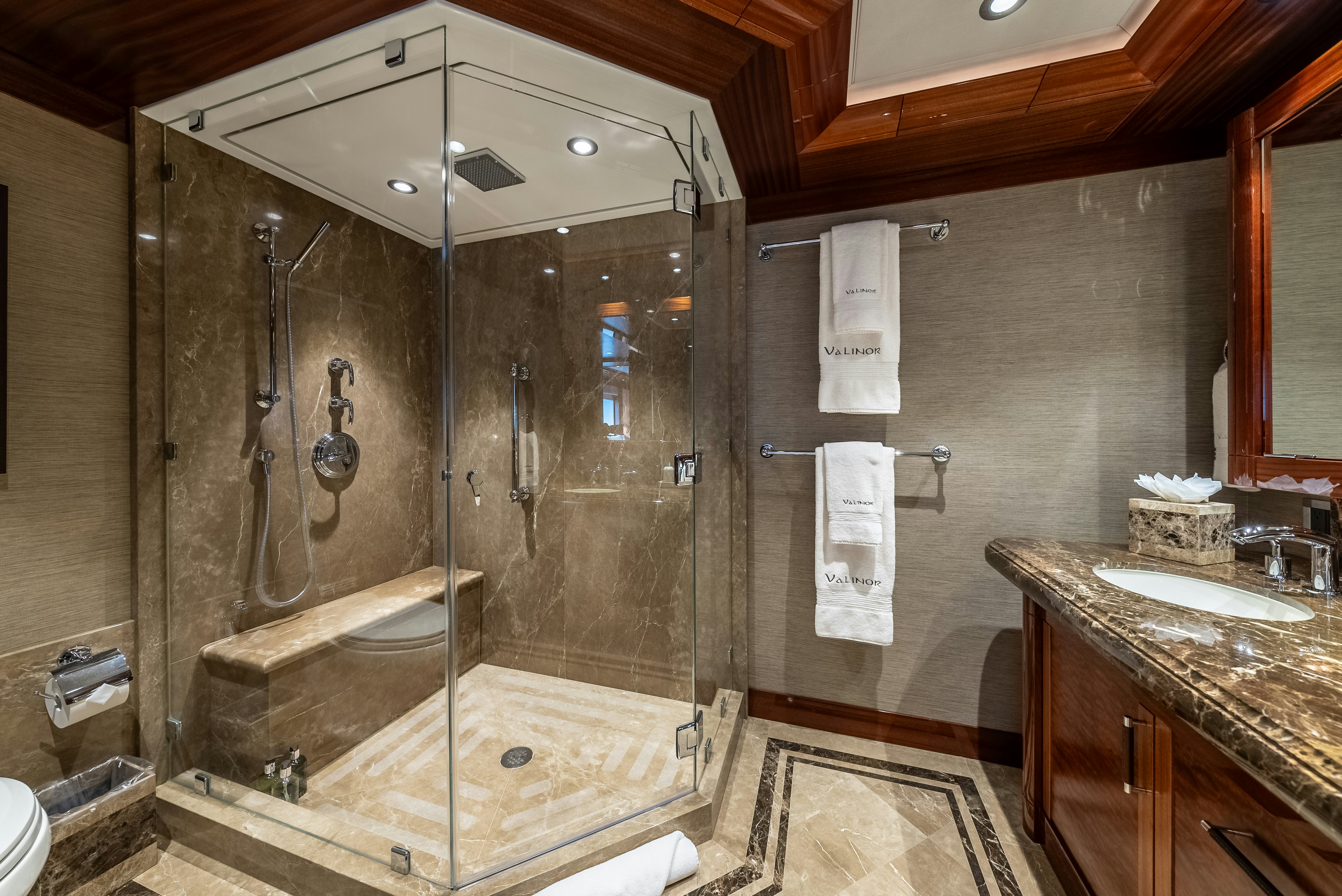 a bathroom with a glass shower aboard VALINOR Yacht for Sale