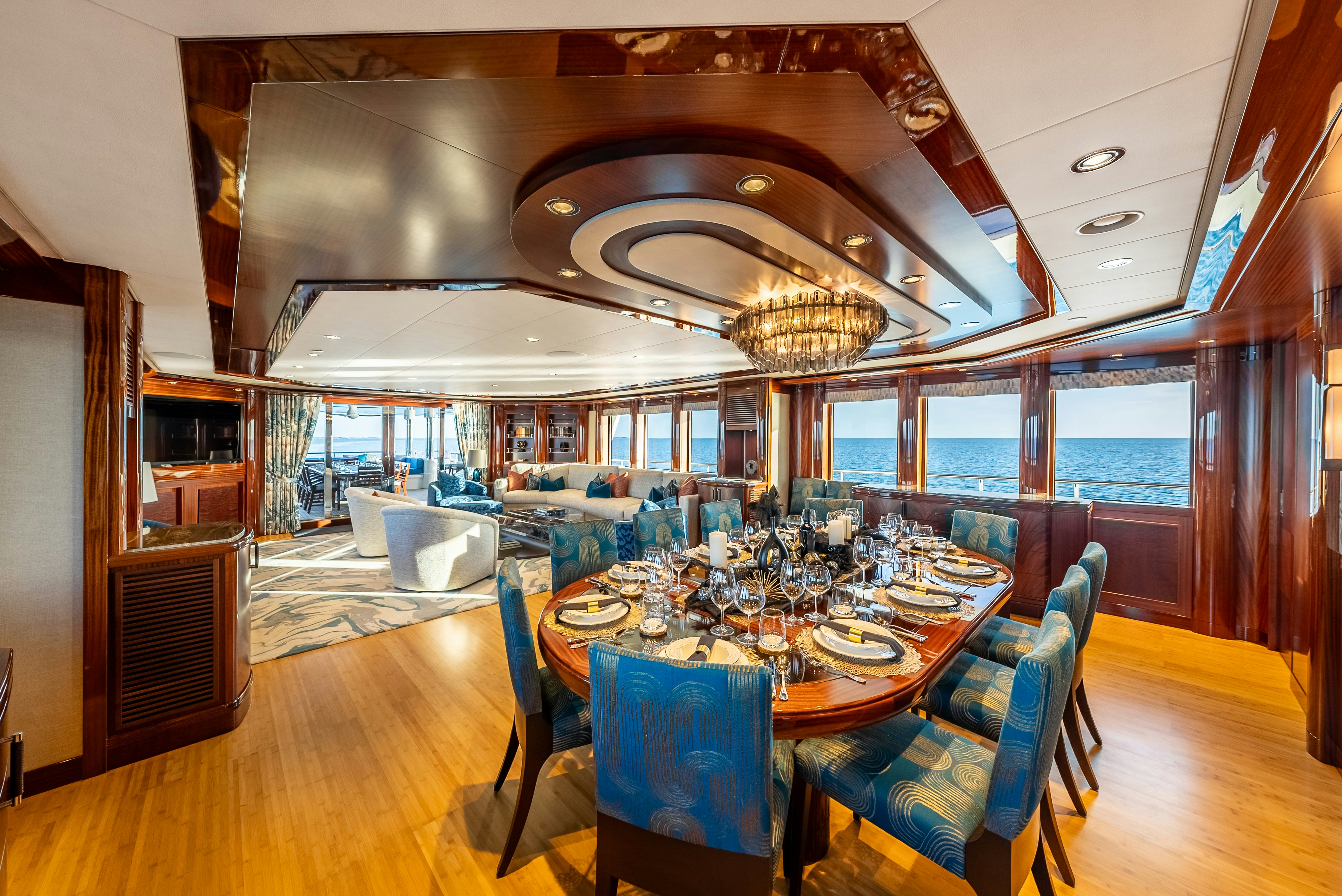 a large dining room with a large chandelier aboard VALINOR Yacht for Sale