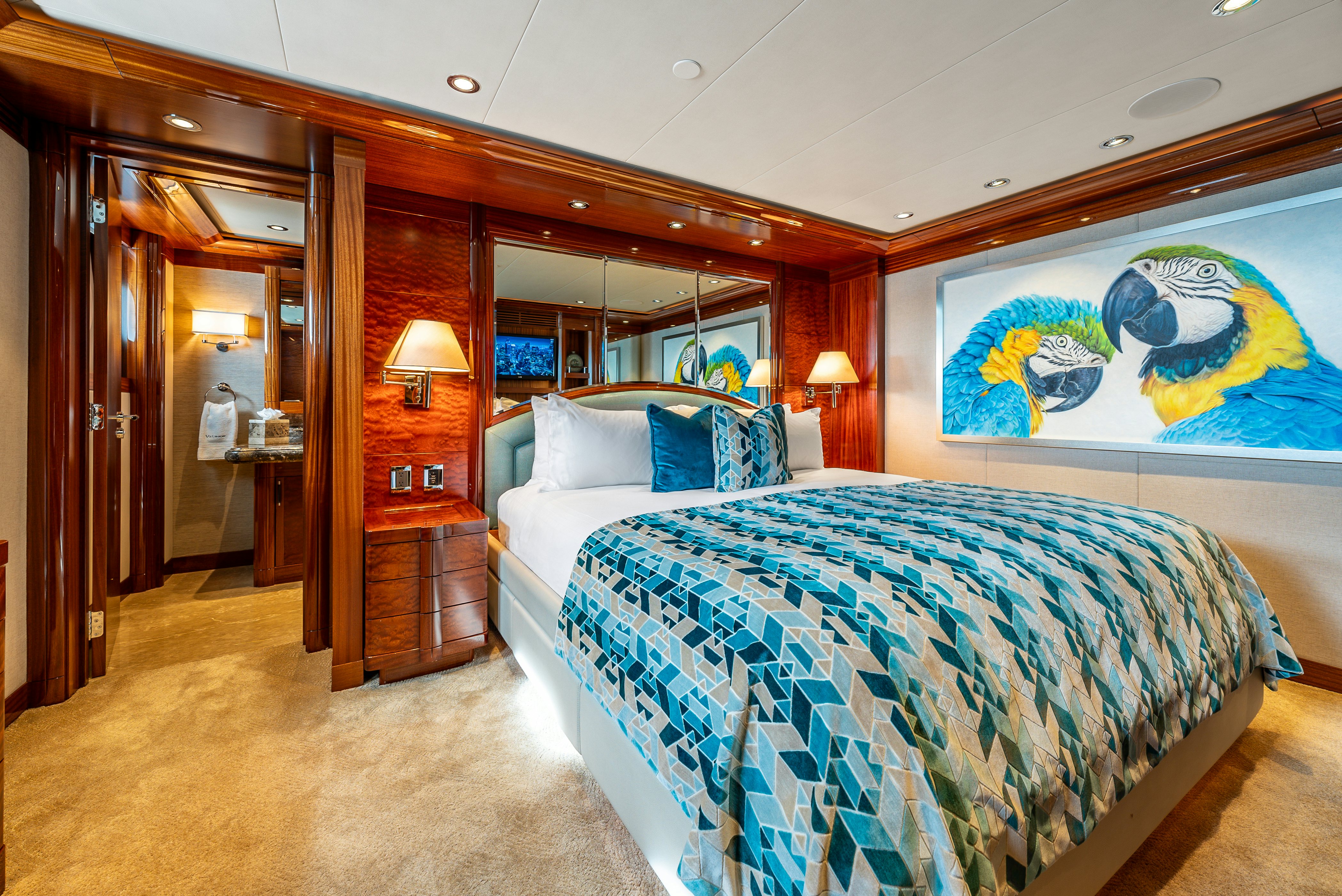 a bedroom with a couple of beds aboard VALINOR Yacht for Sale