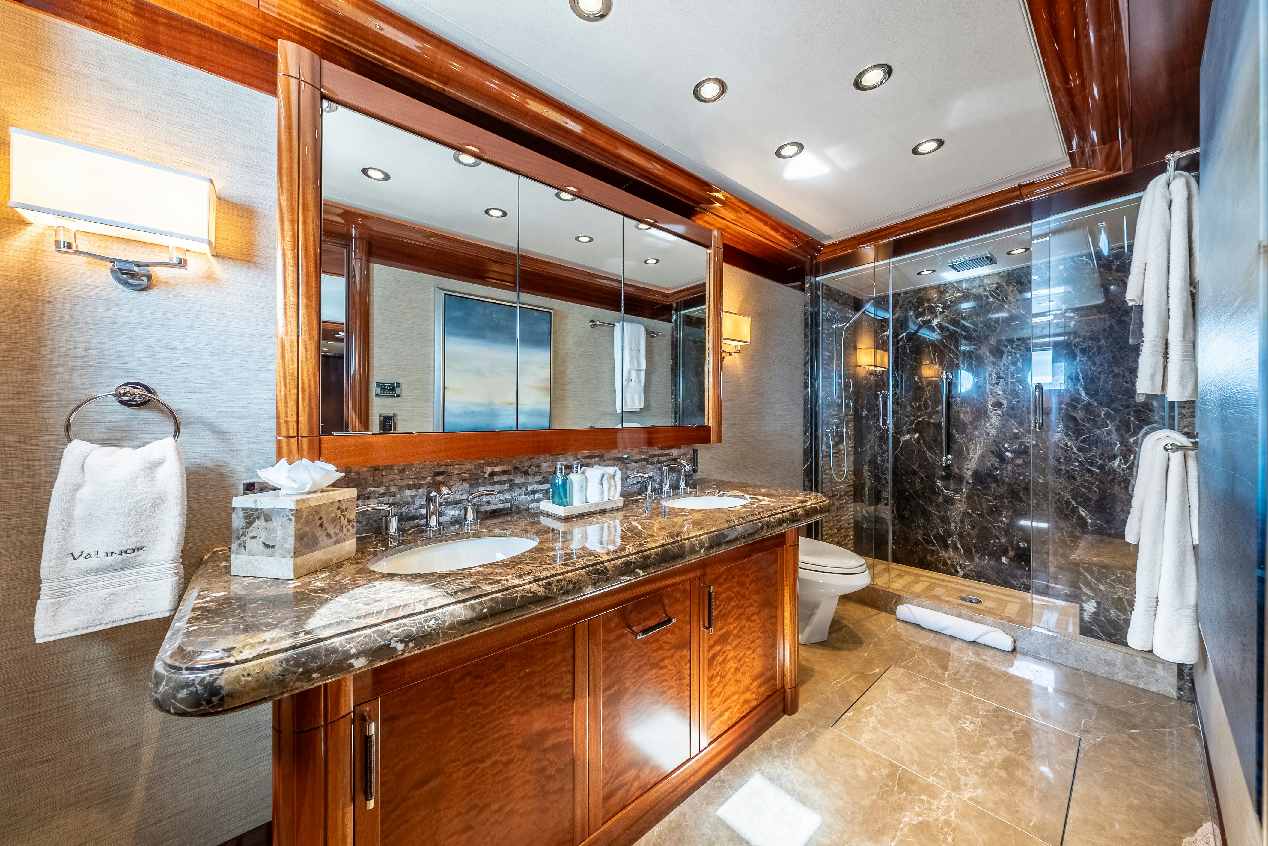 a bathroom with a large mirror aboard VALINOR Yacht for Sale