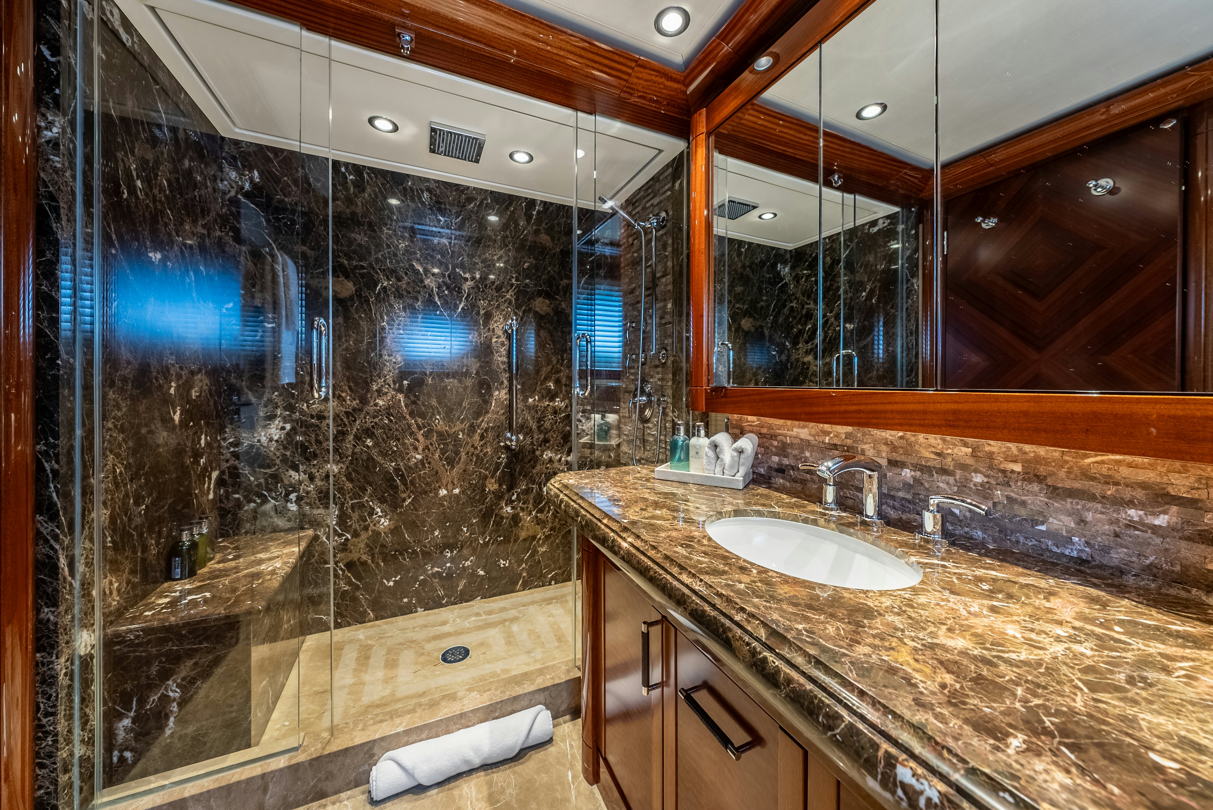 a bathroom with a large mirror aboard VALINOR Yacht for Sale