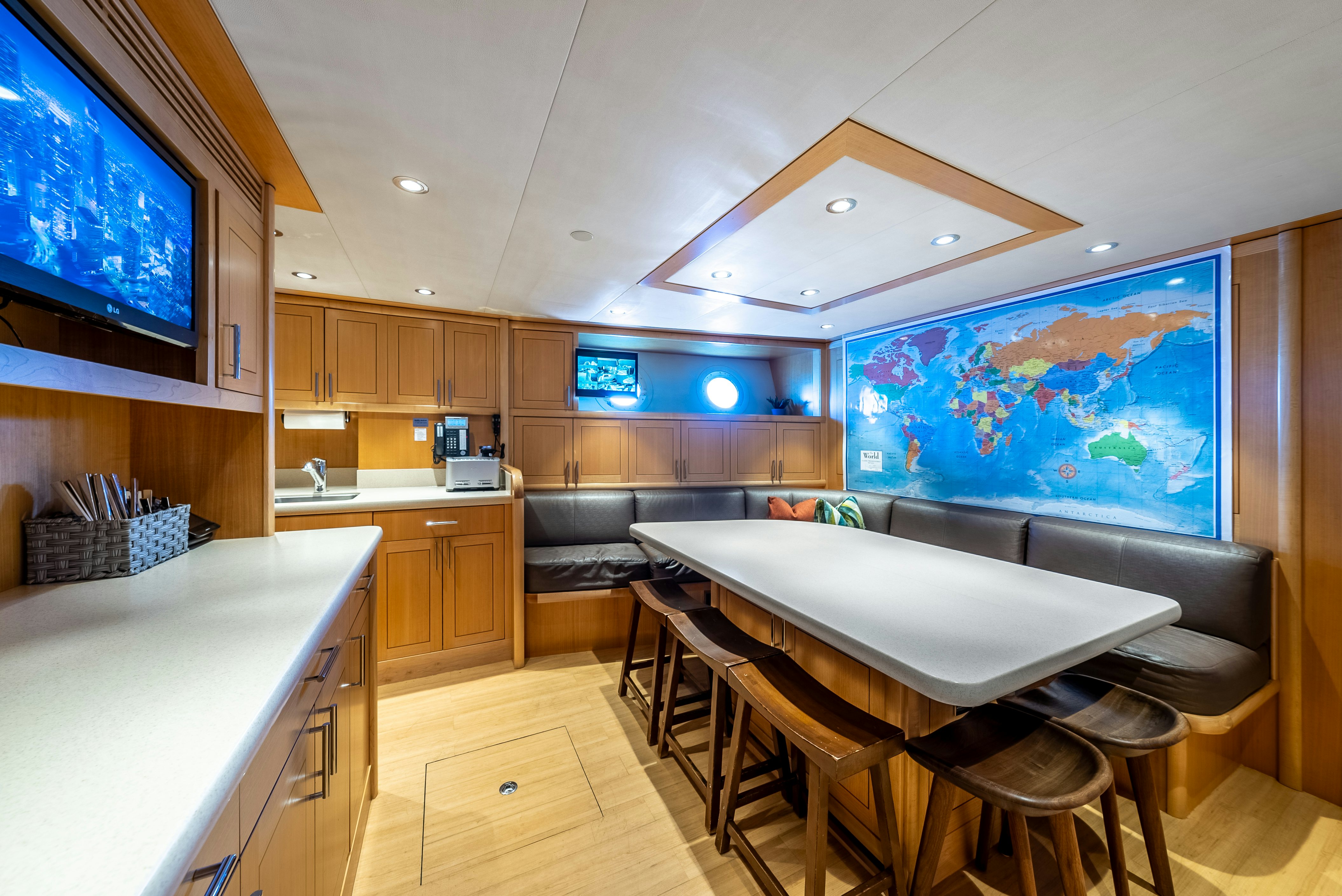a kitchen with a table and chairs aboard VALINOR Yacht for Sale