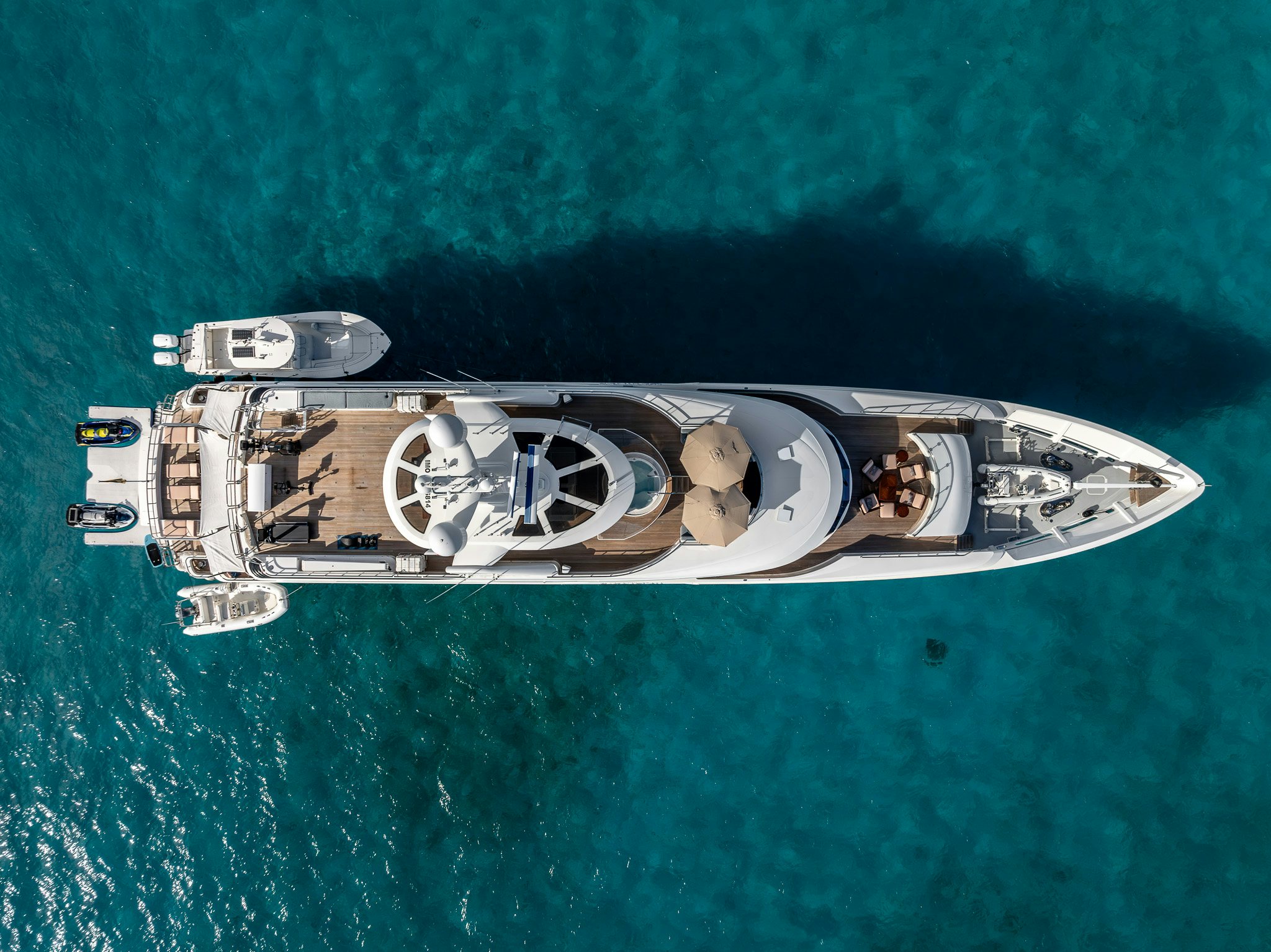 a silver and gold ship on a blue surface aboard VALINOR Yacht for Charter