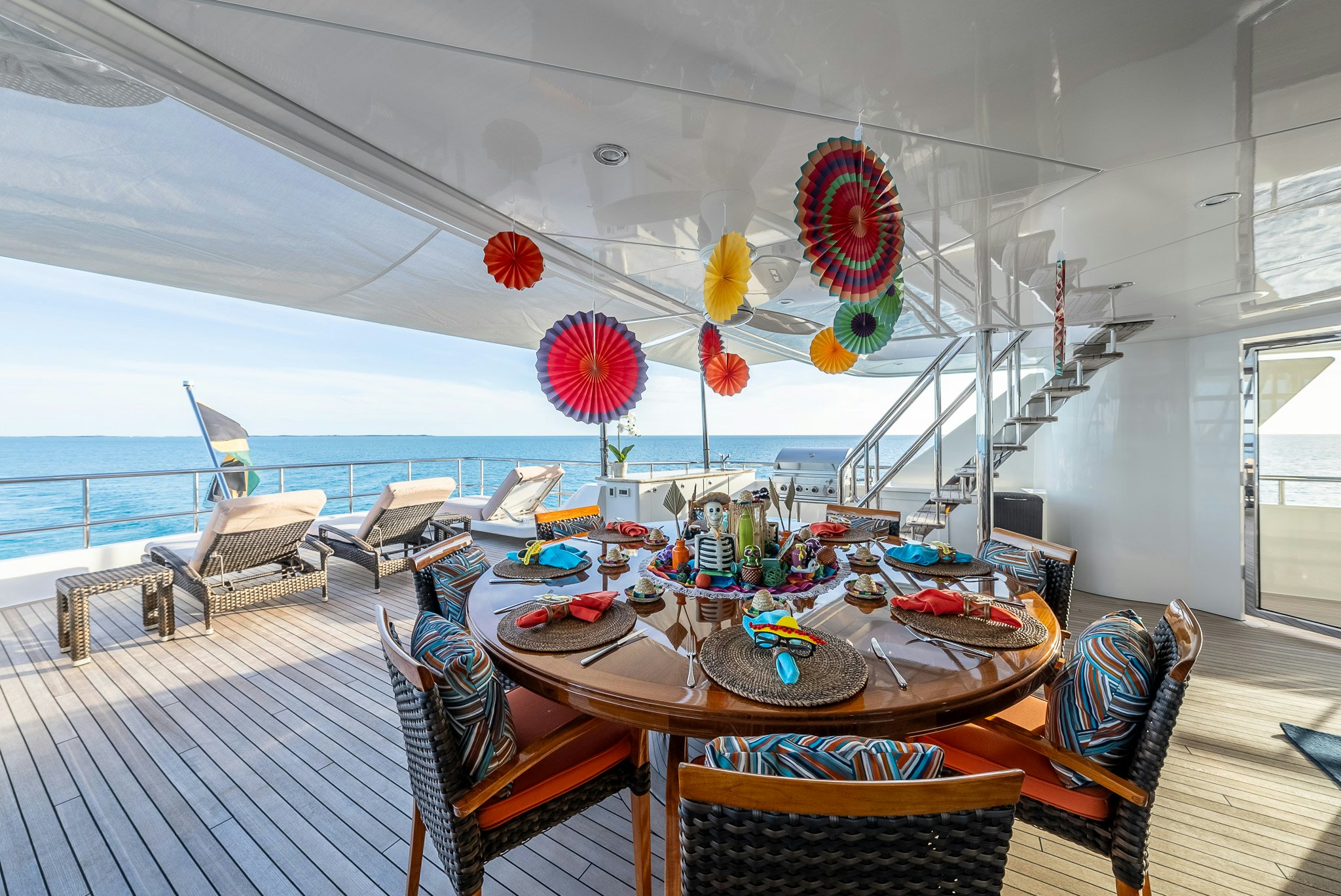 a room with a table chairs and a large window aboard VALINOR Yacht for Charter