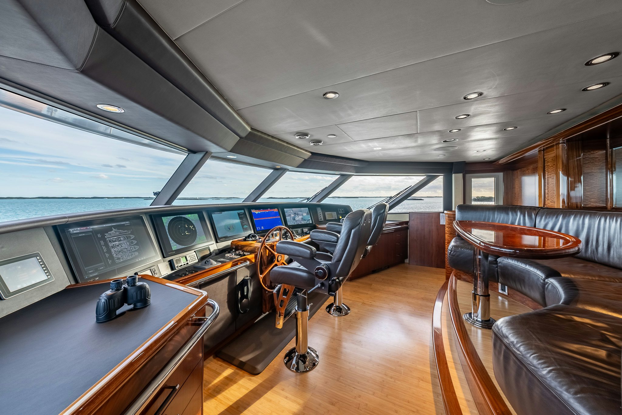 a room with chairs and tables aboard VALINOR Yacht for Charter