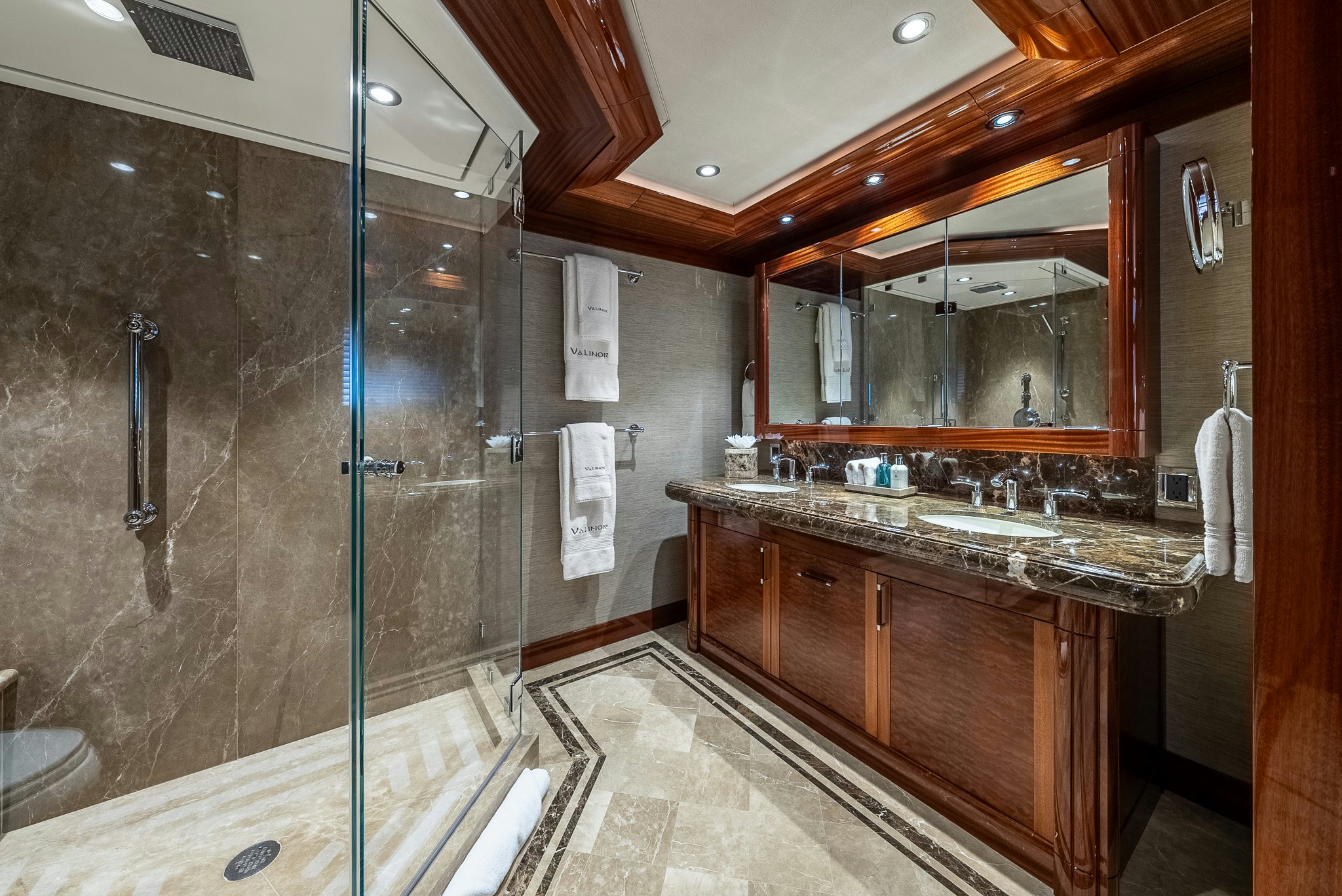 a bathroom with a shower unit and sink aboard VALINOR Yacht for Charter