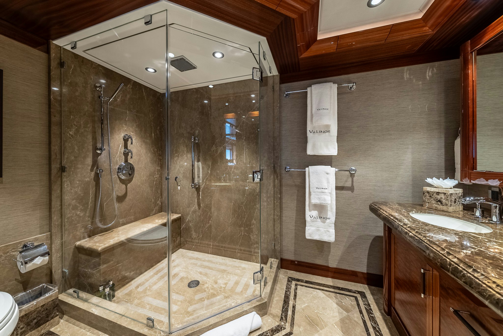 a bathroom with a glass shower aboard VALINOR Yacht for Charter