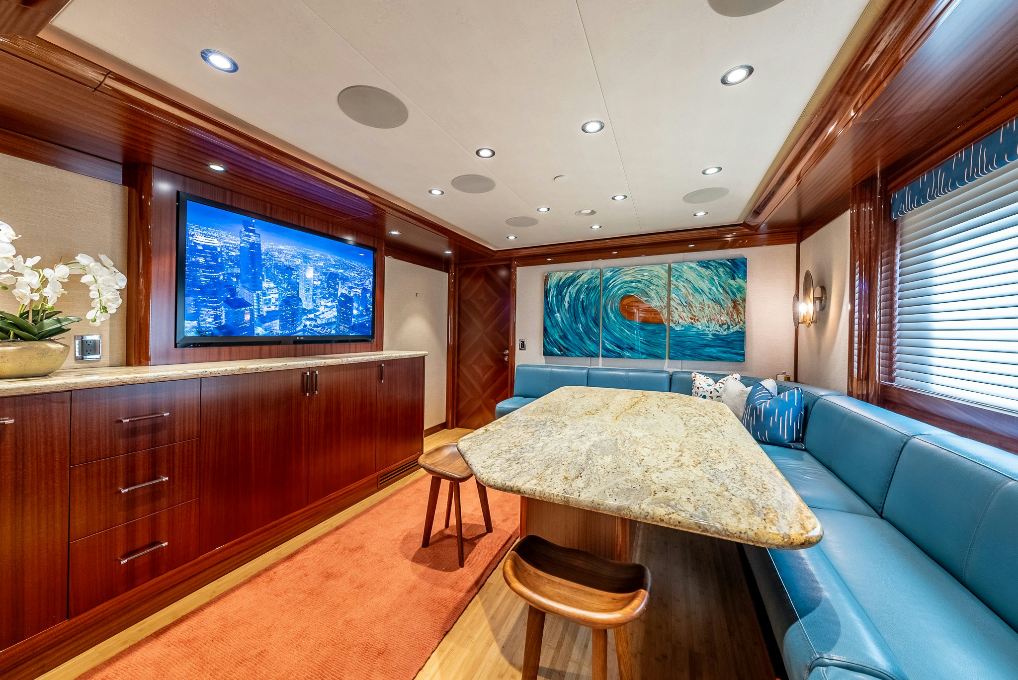 a room with a table and a couch aboard VALINOR Yacht for Charter
