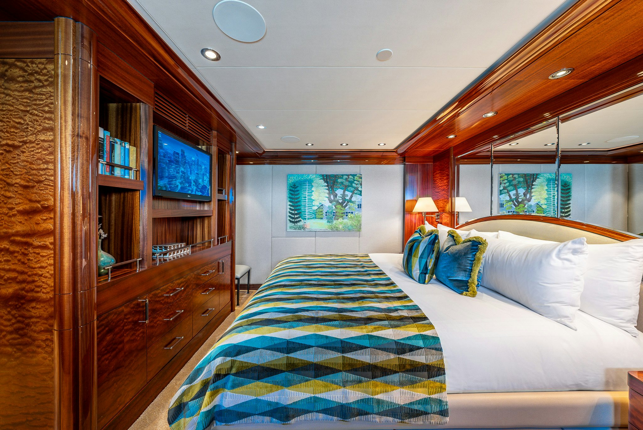 a room with a bed and a desk aboard VALINOR Yacht for Charter