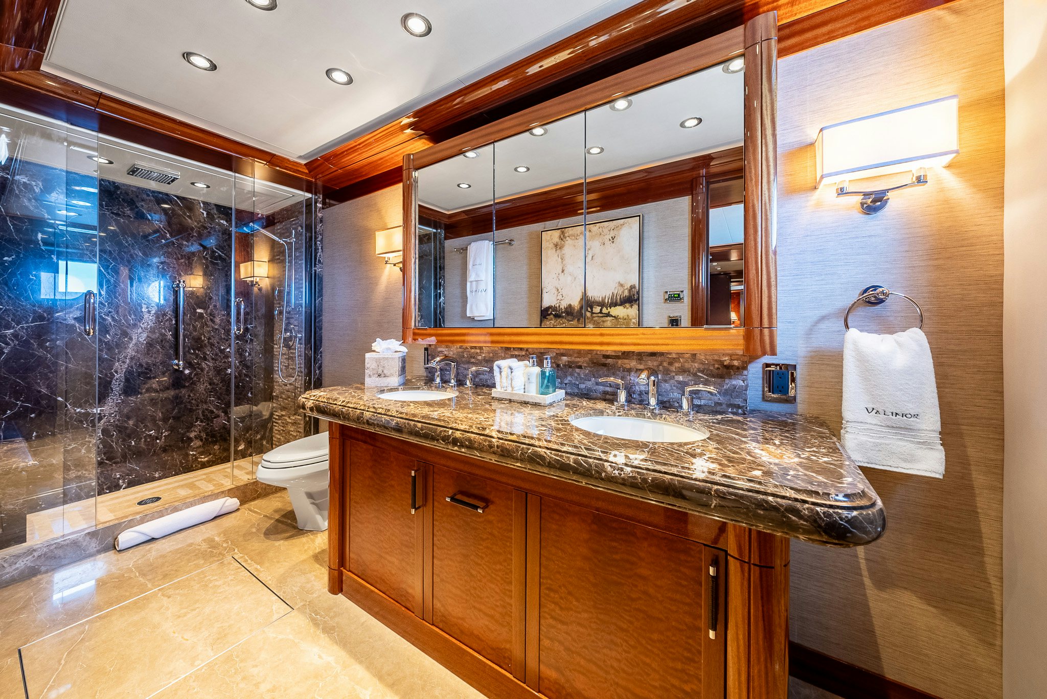 a bathroom with a countertop sink and a large mirror aboard VALINOR Yacht for Charter