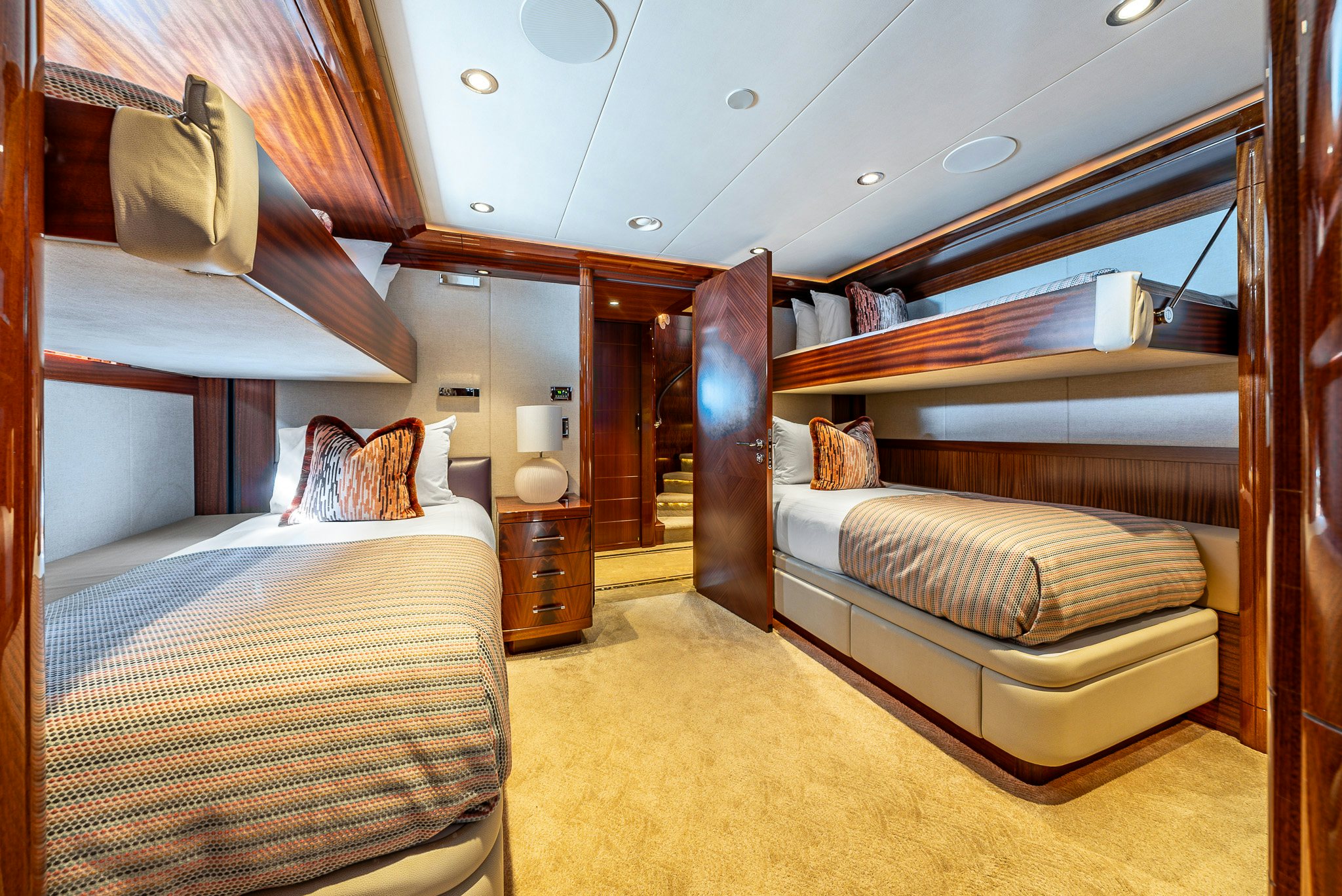 a bedroom with a bed and a couch aboard VALINOR Yacht for Charter