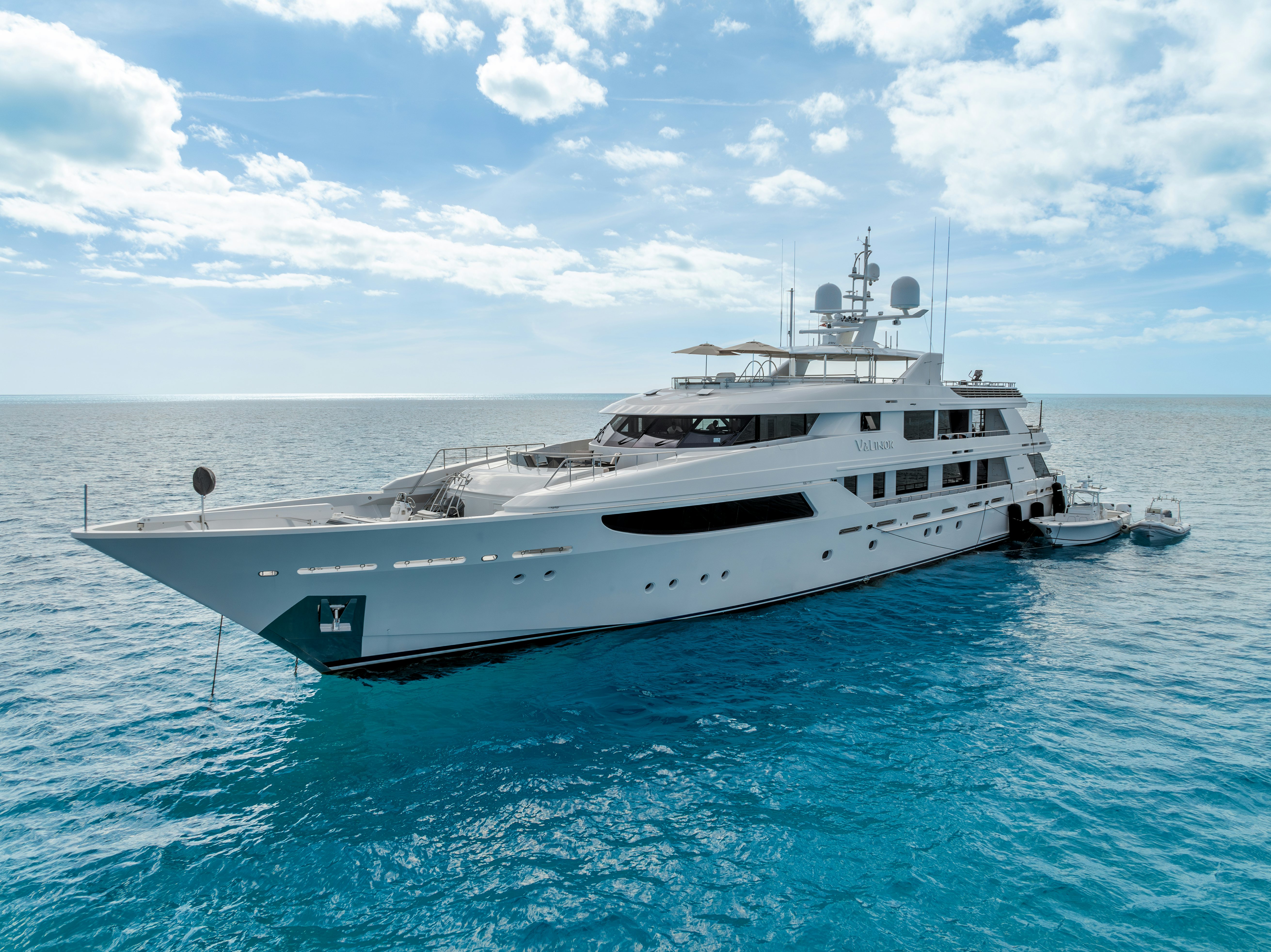 a white yacht in the water aboard VALINOR Yacht for Sale