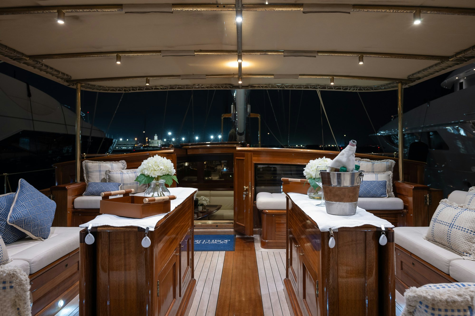 a room with a table and chairs aboard DONA FRANCISCA Yacht for Sale