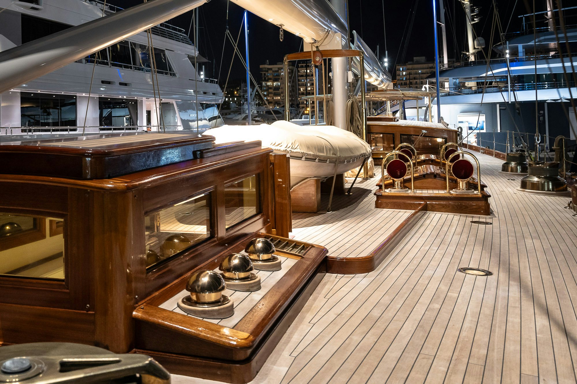 a room with a large bed and a table aboard DONA FRANCISCA Yacht for Sale