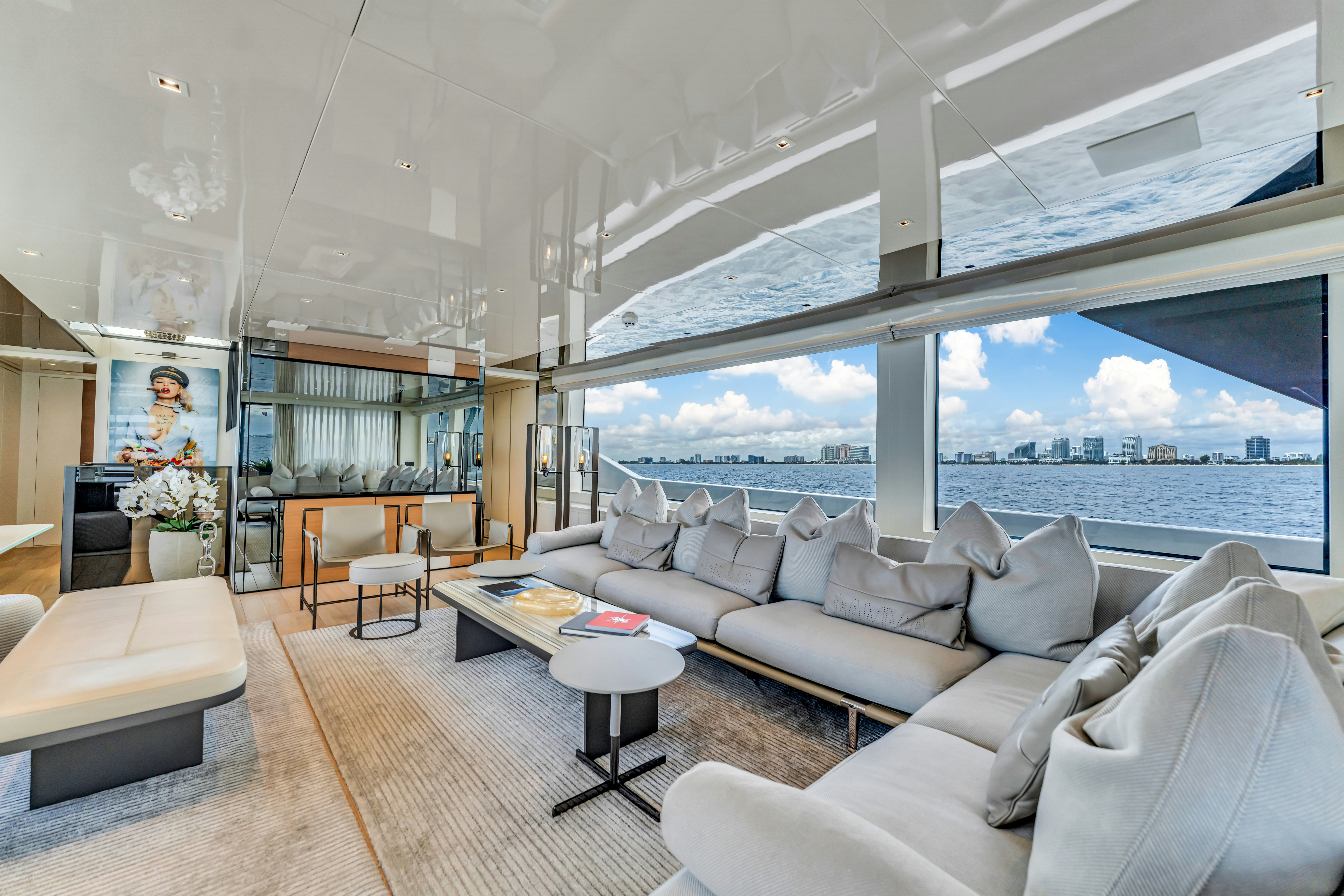 a living room with a large window aboard NOTYNOG Yacht for Charter