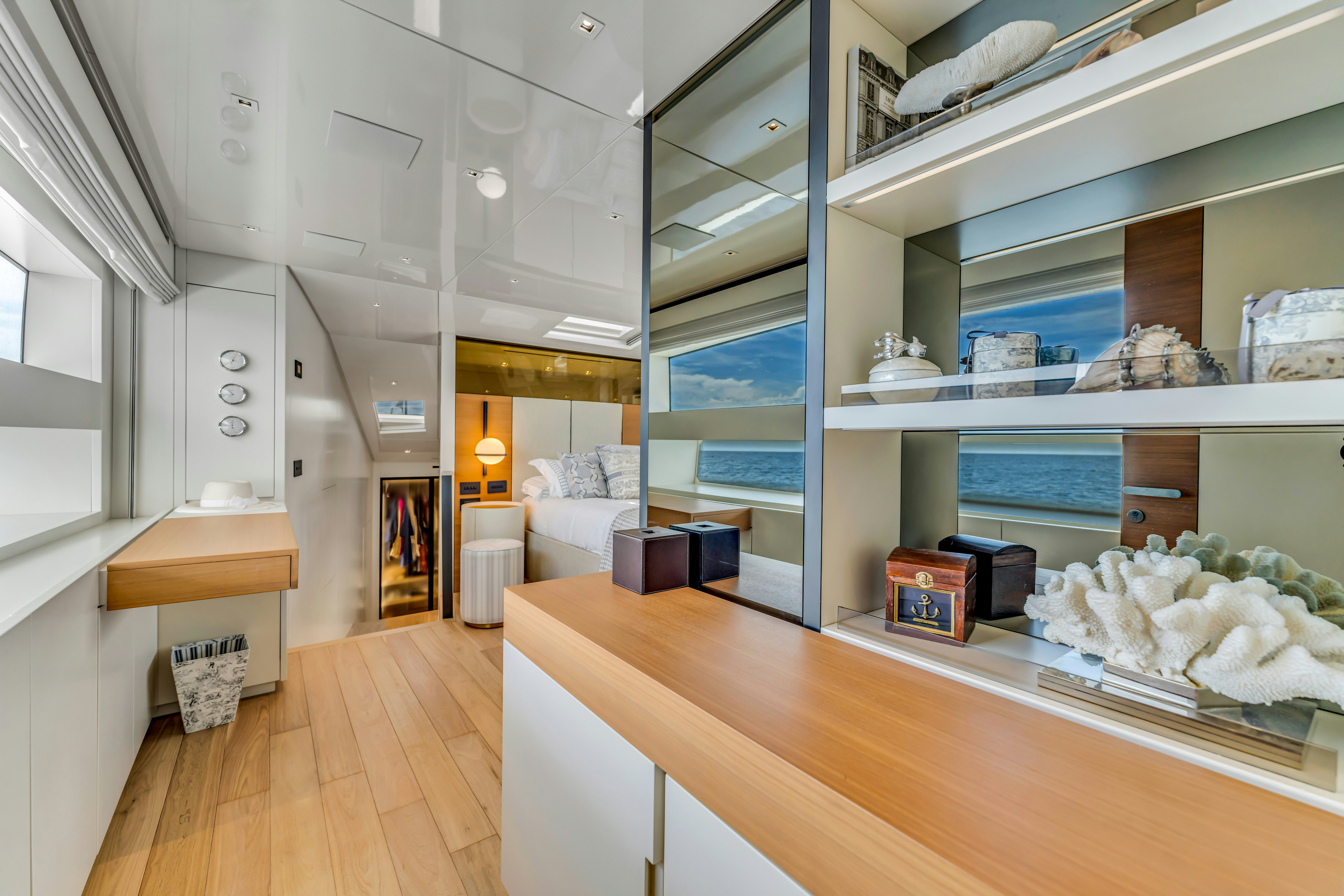 a room with a large shelf and a bed in it aboard NOTYNOG Yacht for Charter