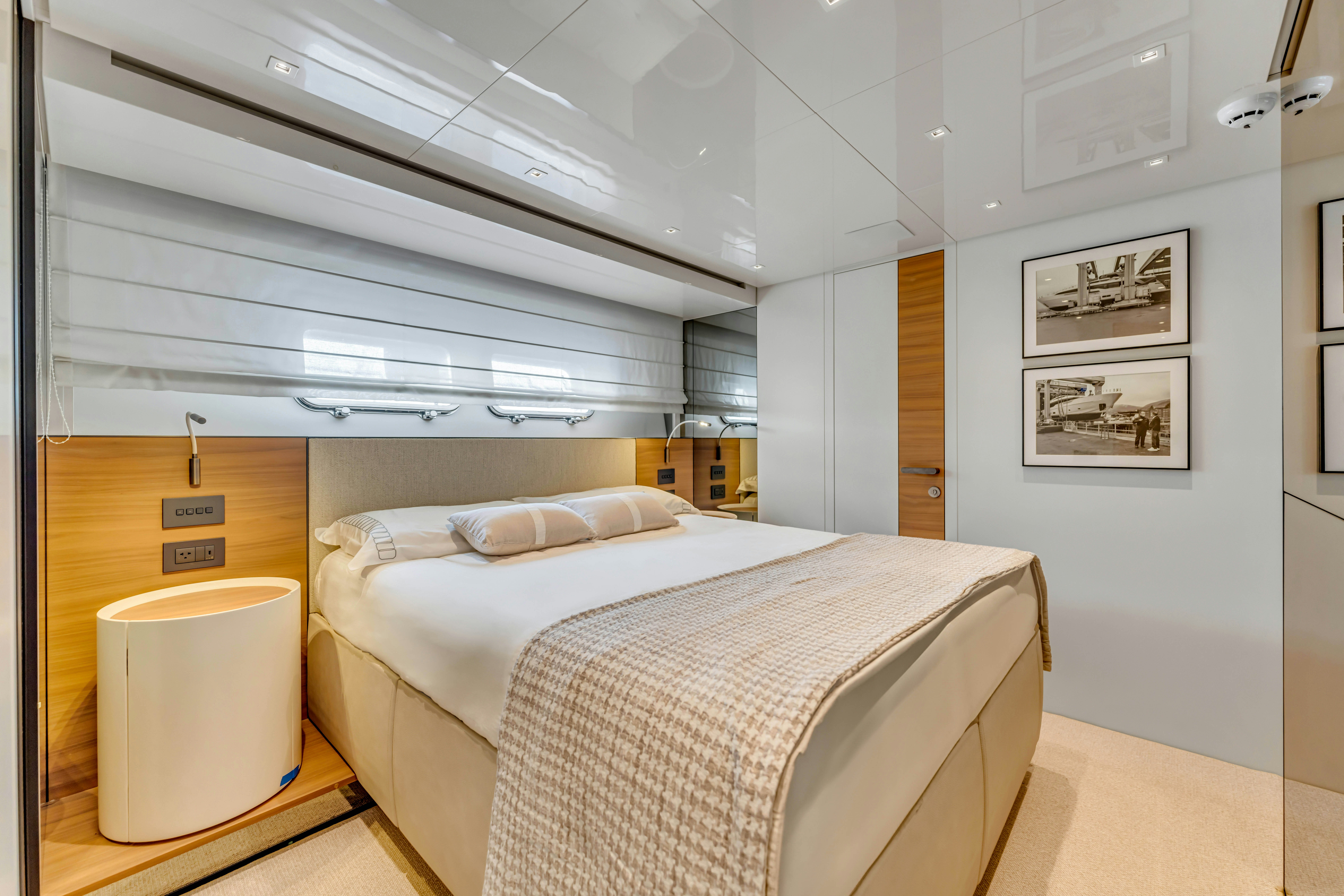 a room with a bed and a desk aboard NOTYNOG Yacht for Charter