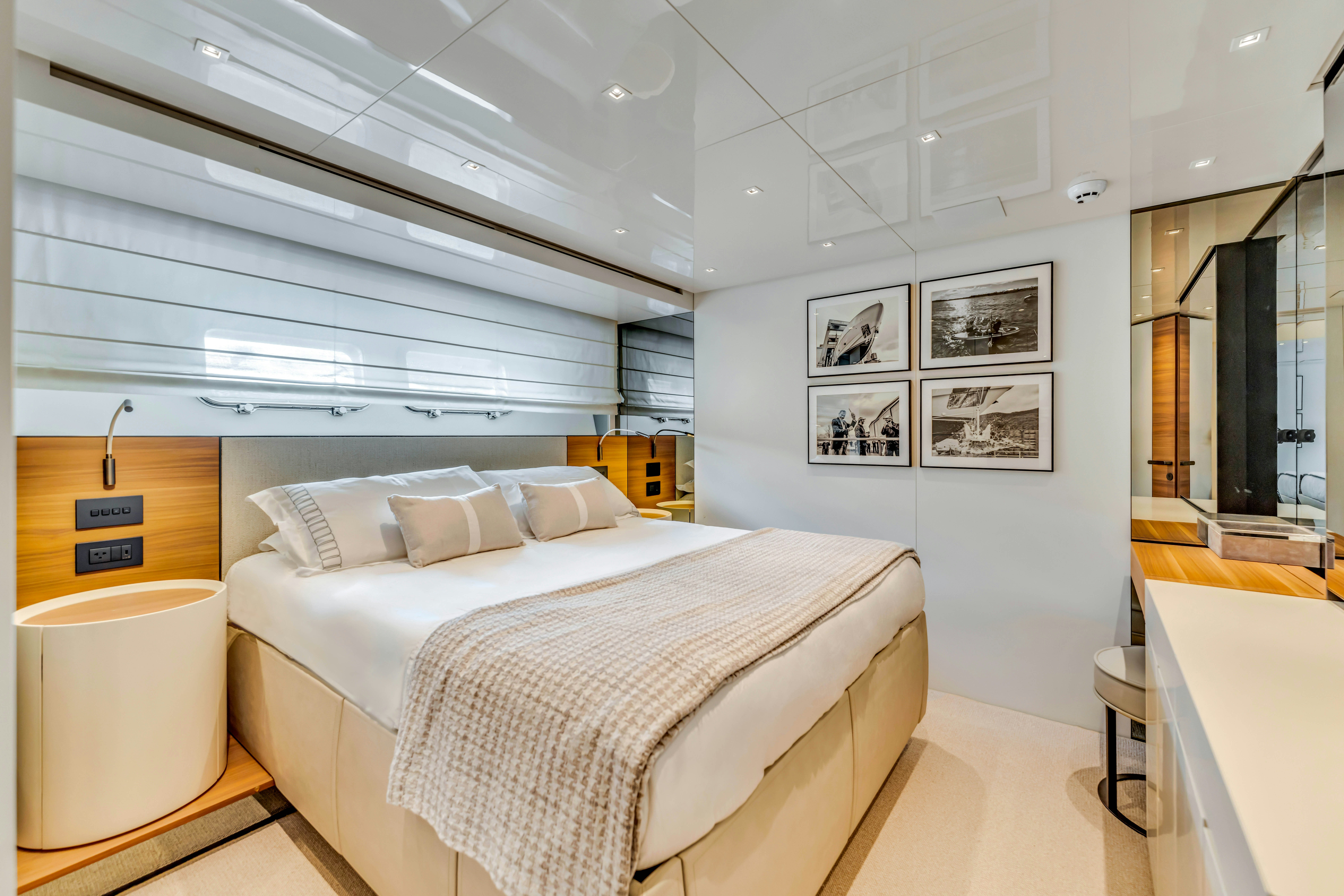 a room with a bed and a desk aboard NOTYNOG Yacht for Charter