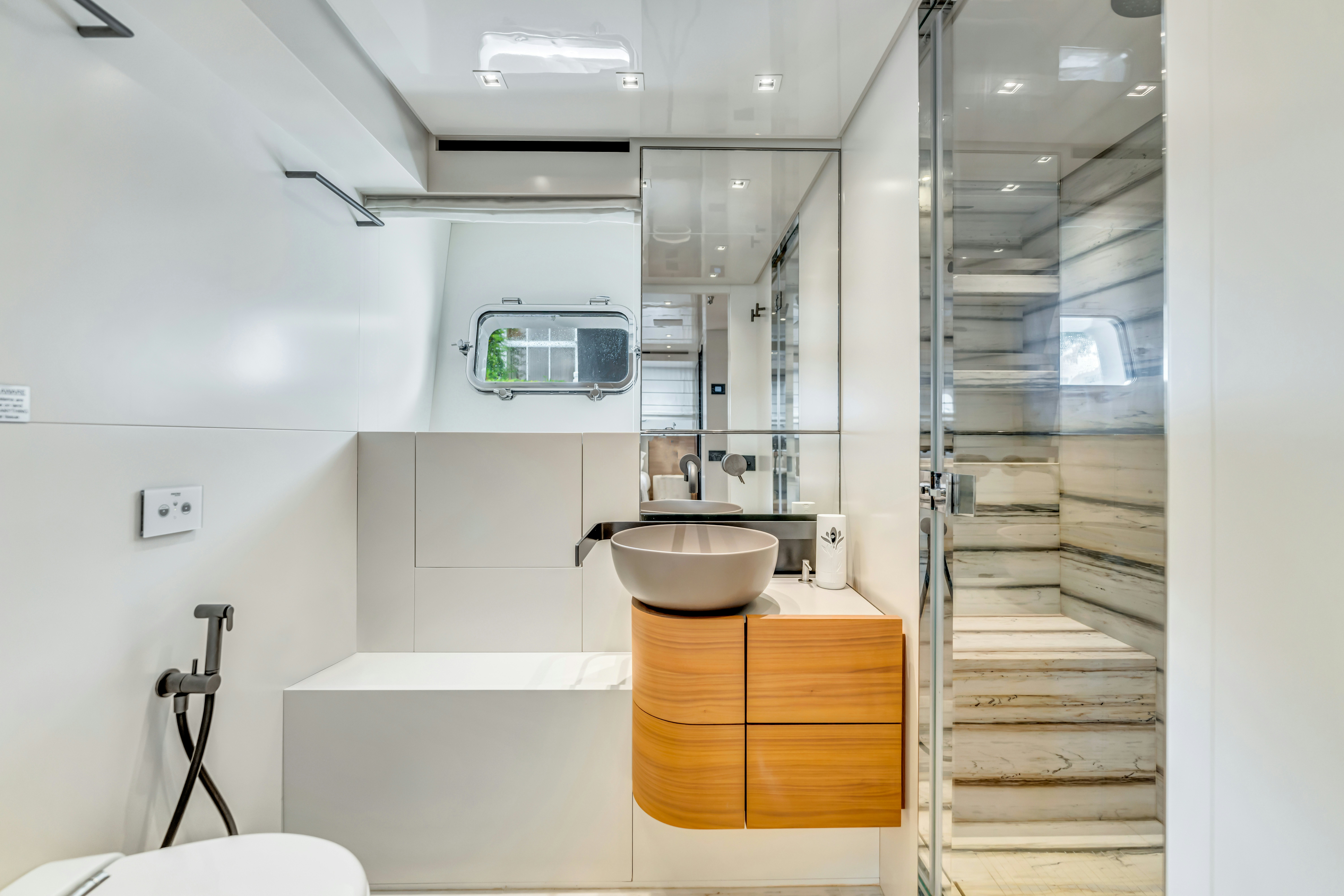 a bathroom with a sink and a ladder aboard NOTYNOG Yacht for Charter