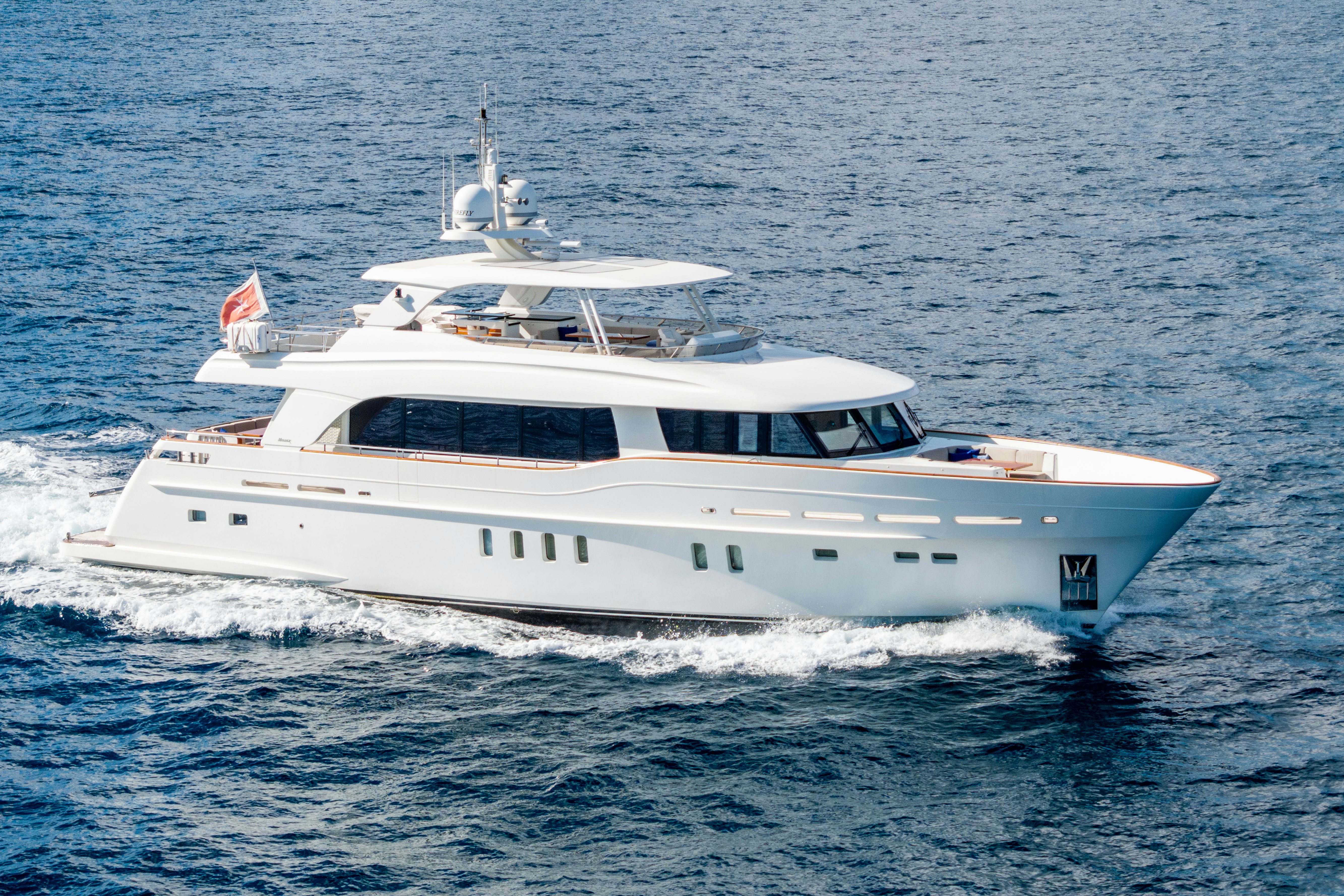 a white yacht in the water aboard FIREFLY Yacht for Sale