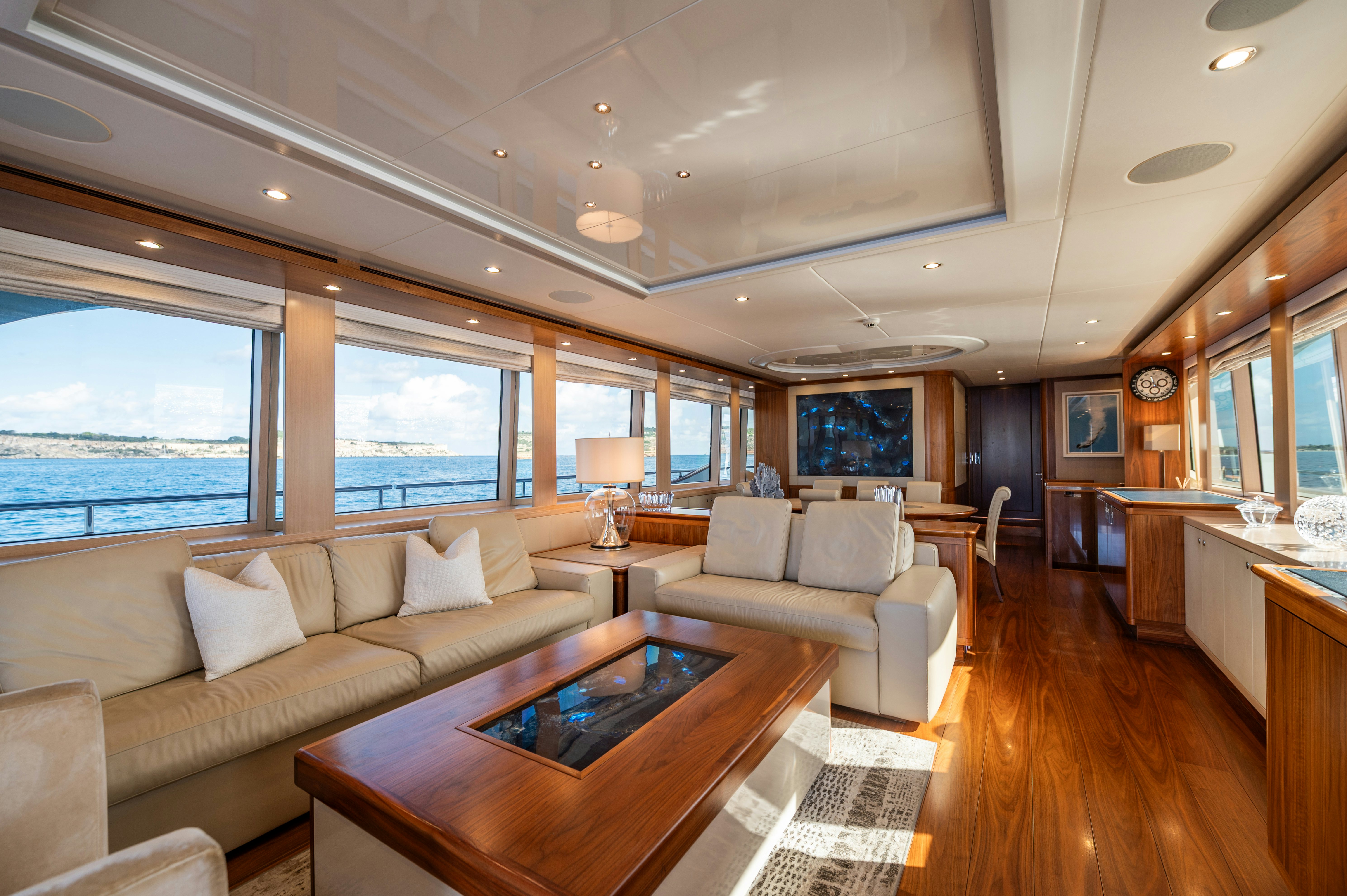 a living room with a large window aboard FIREFLY Yacht for Sale