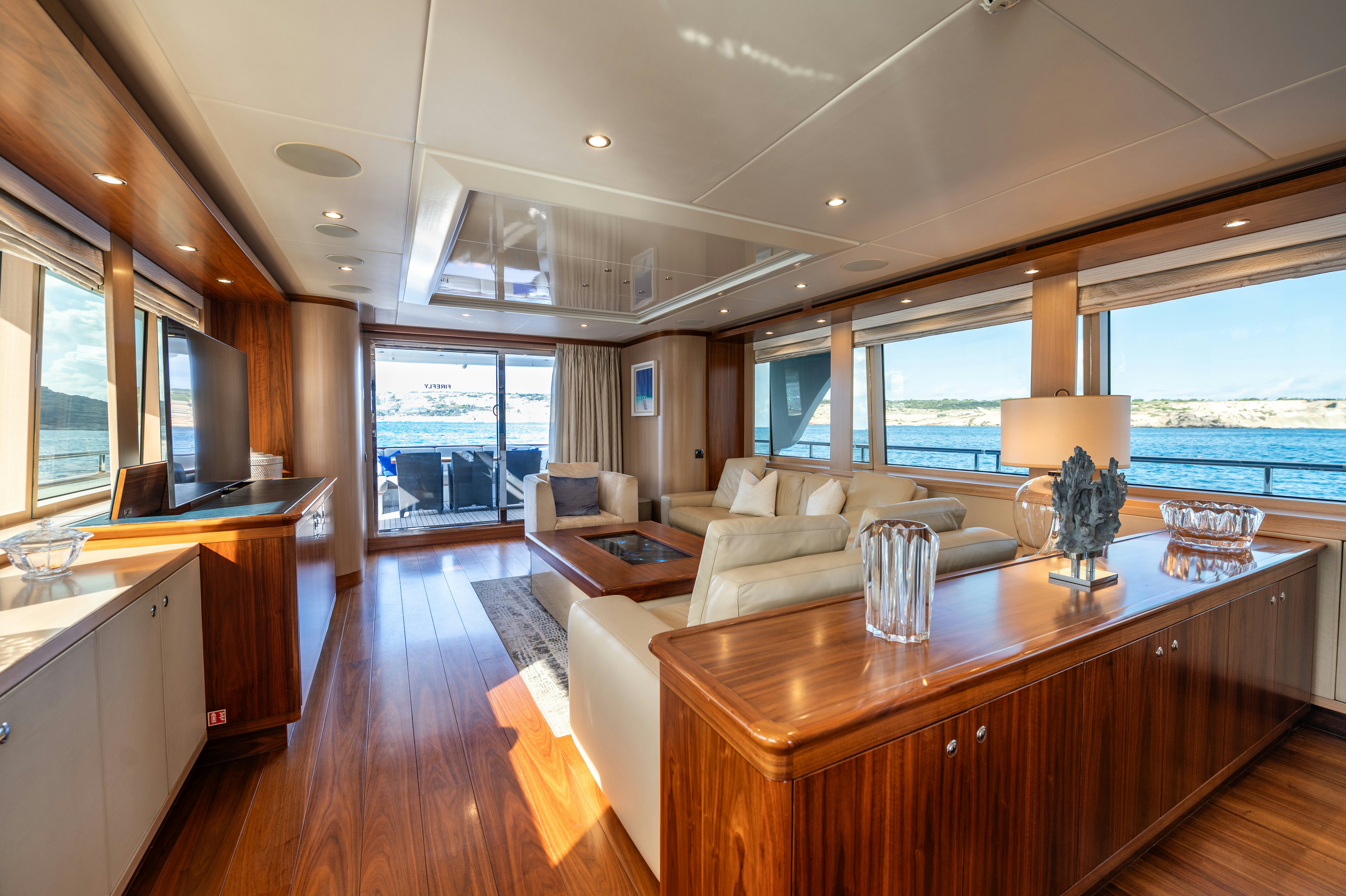 a large kitchen and living room aboard FIREFLY Yacht for Sale