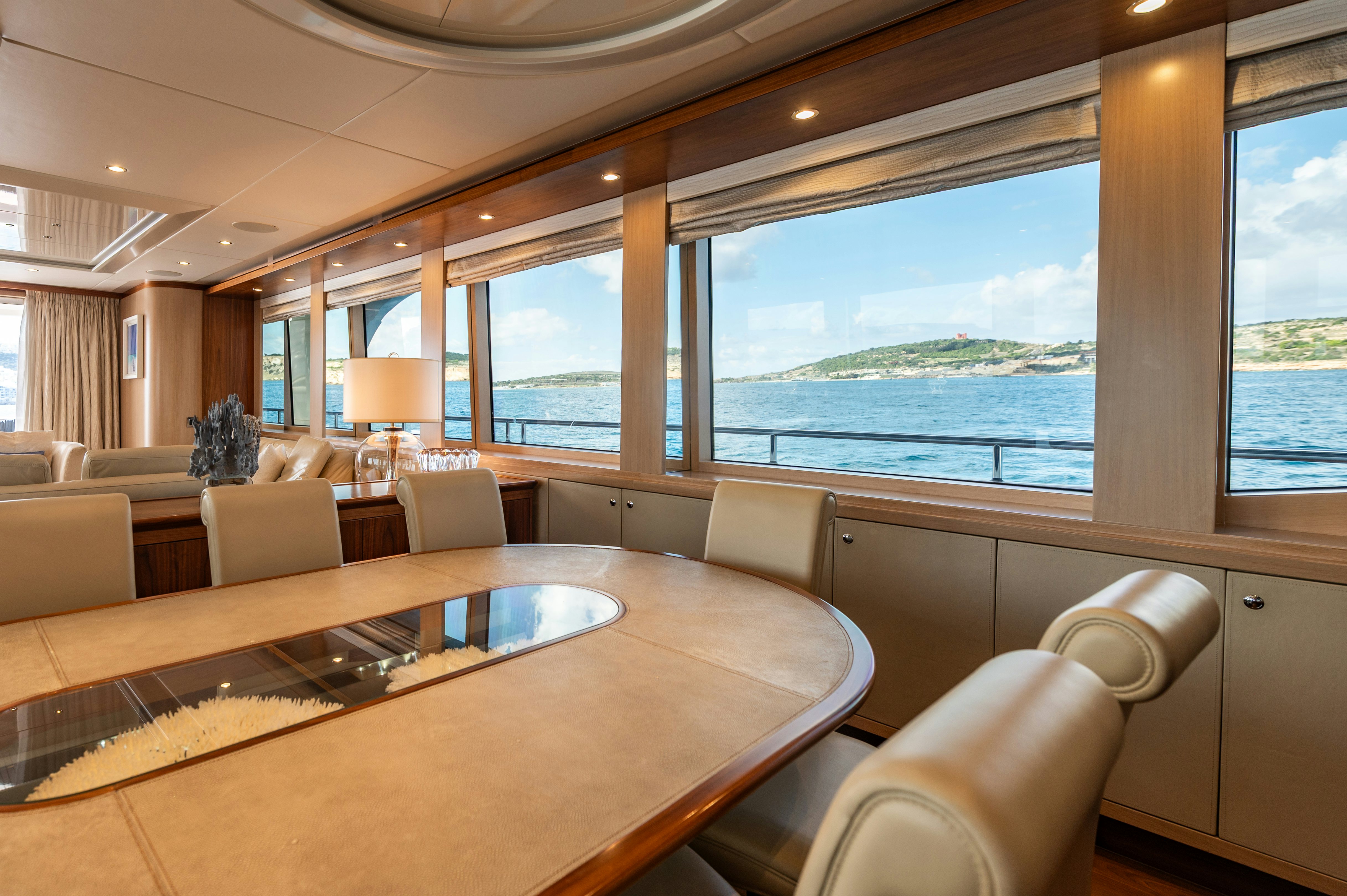 a living room with a large window aboard FIREFLY Yacht for Sale