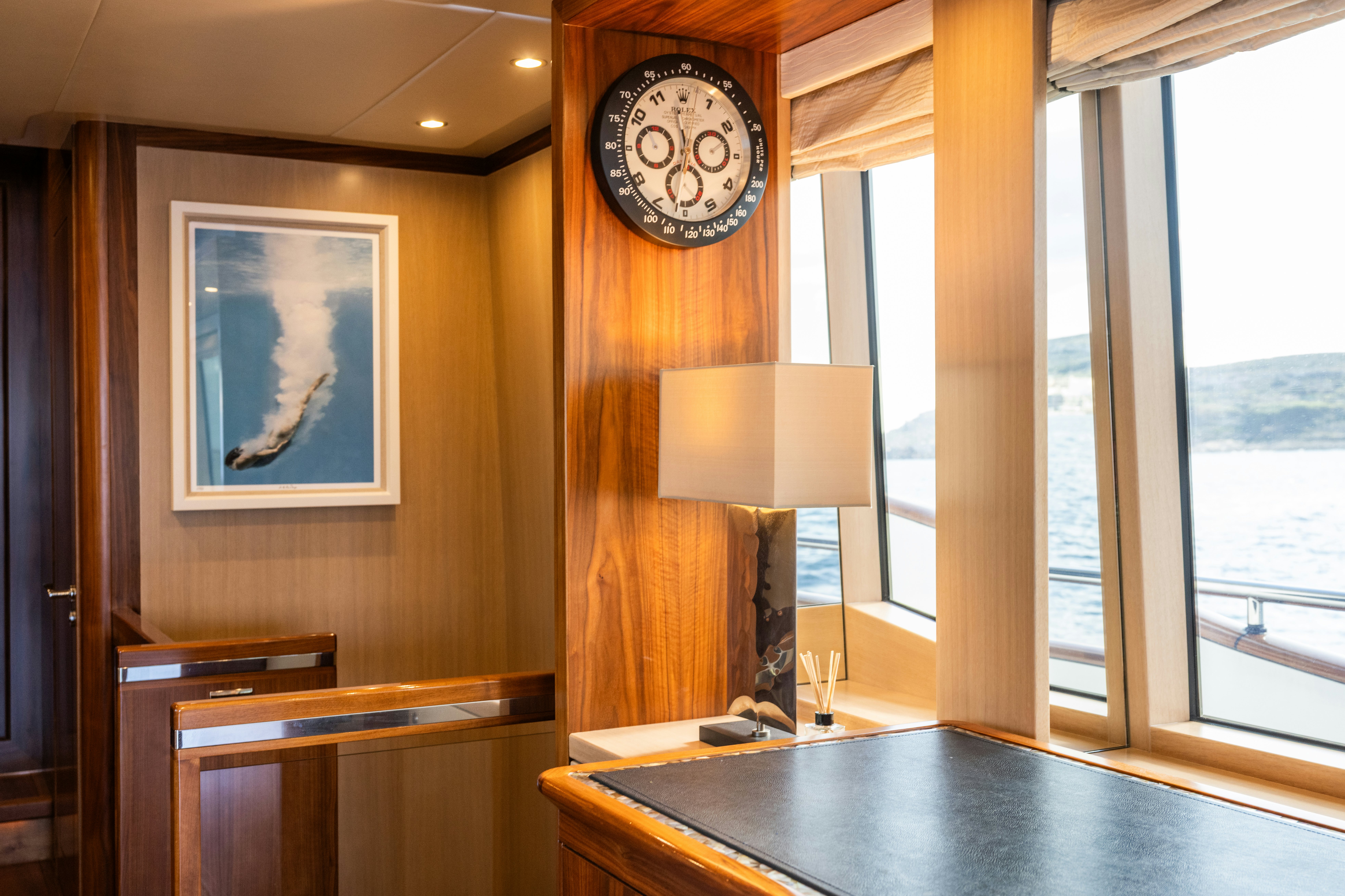 a clock on a wall aboard FIREFLY Yacht for Sale