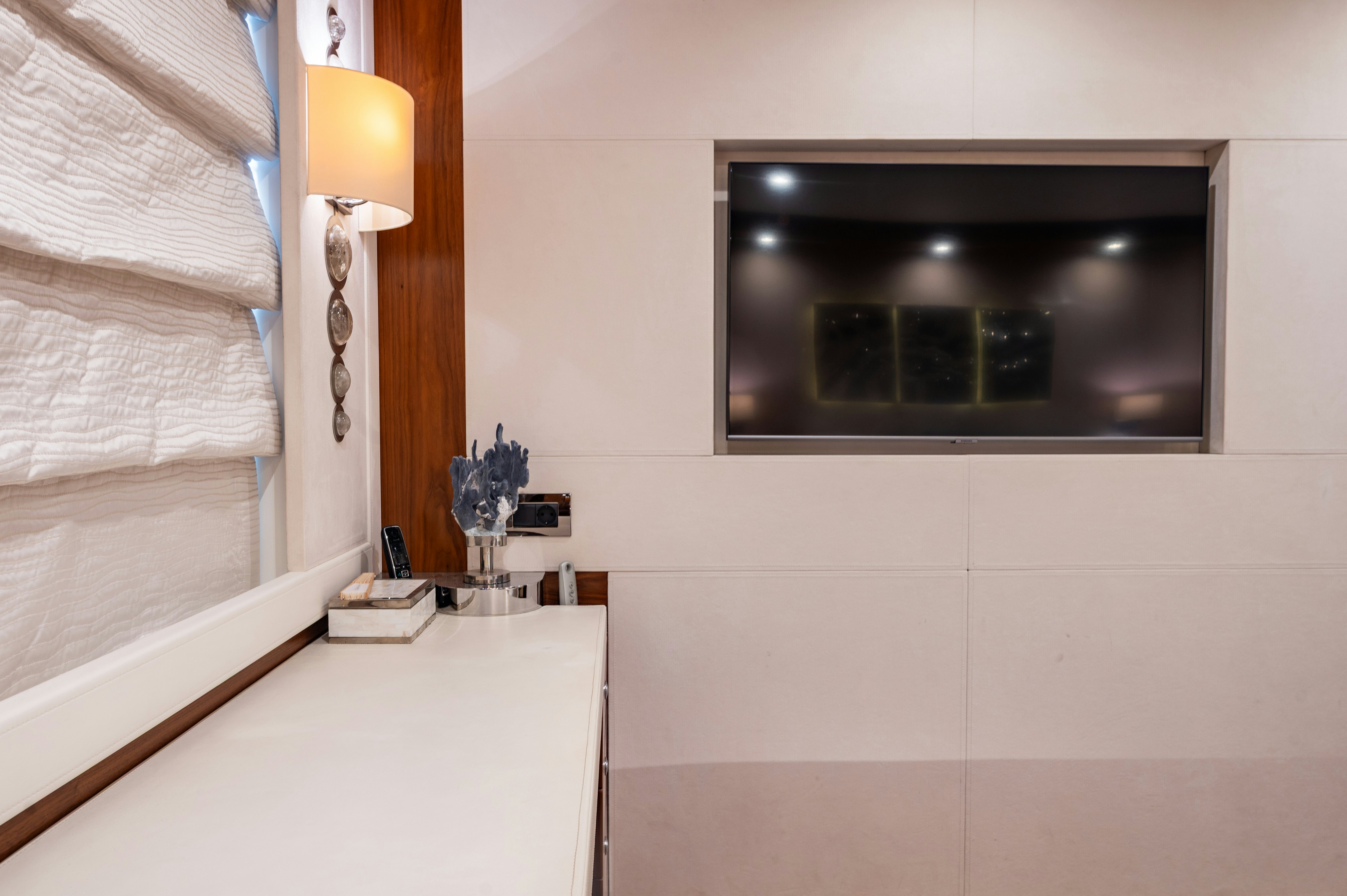 a tv on a wall aboard FIREFLY Yacht for Sale